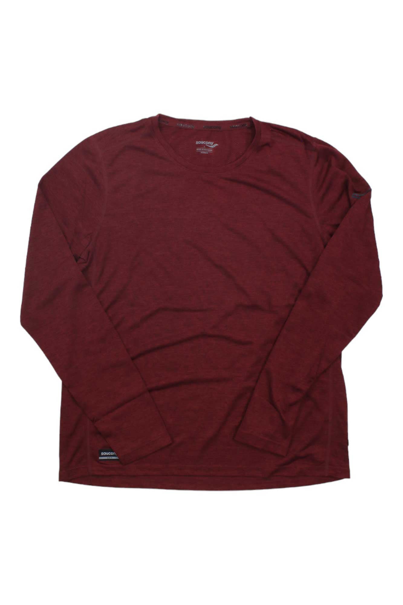 The Saucony Women's Stopwatch LS Top is a maroon long sleeve running shirt with a crew neck, made from recycled polyester and breathable mesh panels, shown laid flat on a white background.