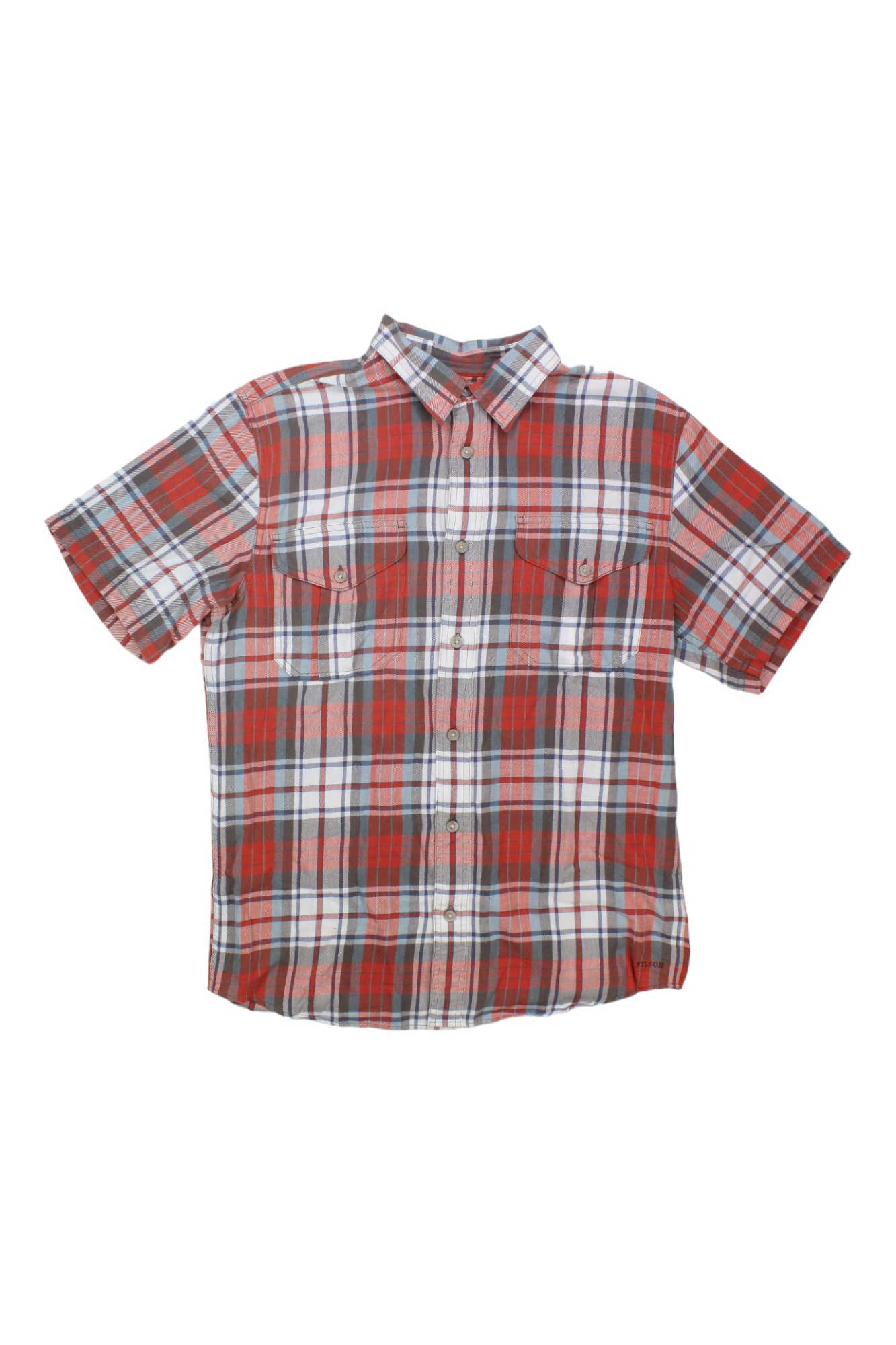The Filson Men's Alaskan Guide Shirt is a short-sleeved, button-up outdoor shirt featuring red, white, and blue plaid and two chest pockets, inspired by rugged classic designs.