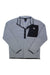 The Burton Mens Cinder Fleece Pullover is a light grey, relaxed-fit top made from soft recycled polar fleece, featuring a black snap-button placket, a black chest pocket with a white mountain logo, and a slightly raised collar for comfort.