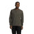 A person stands facing forward, wearing The North Face Mens Waffle LS Henley in dark olive-green and black pants against a plain white background.