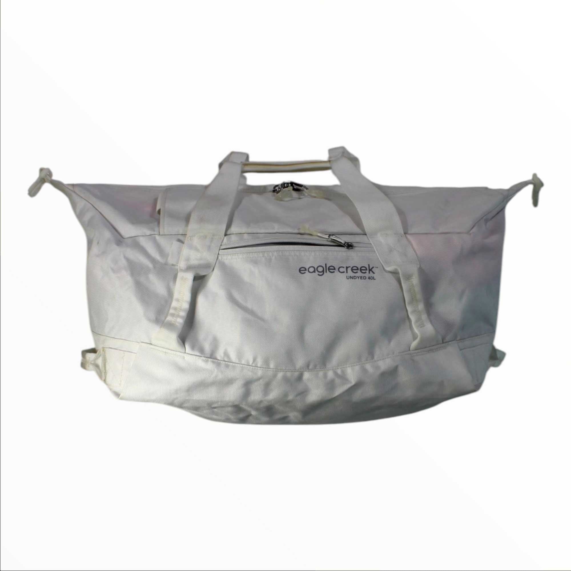 Light gray duffel-style 38L carry-on luggage with dual handles and front zip pocket