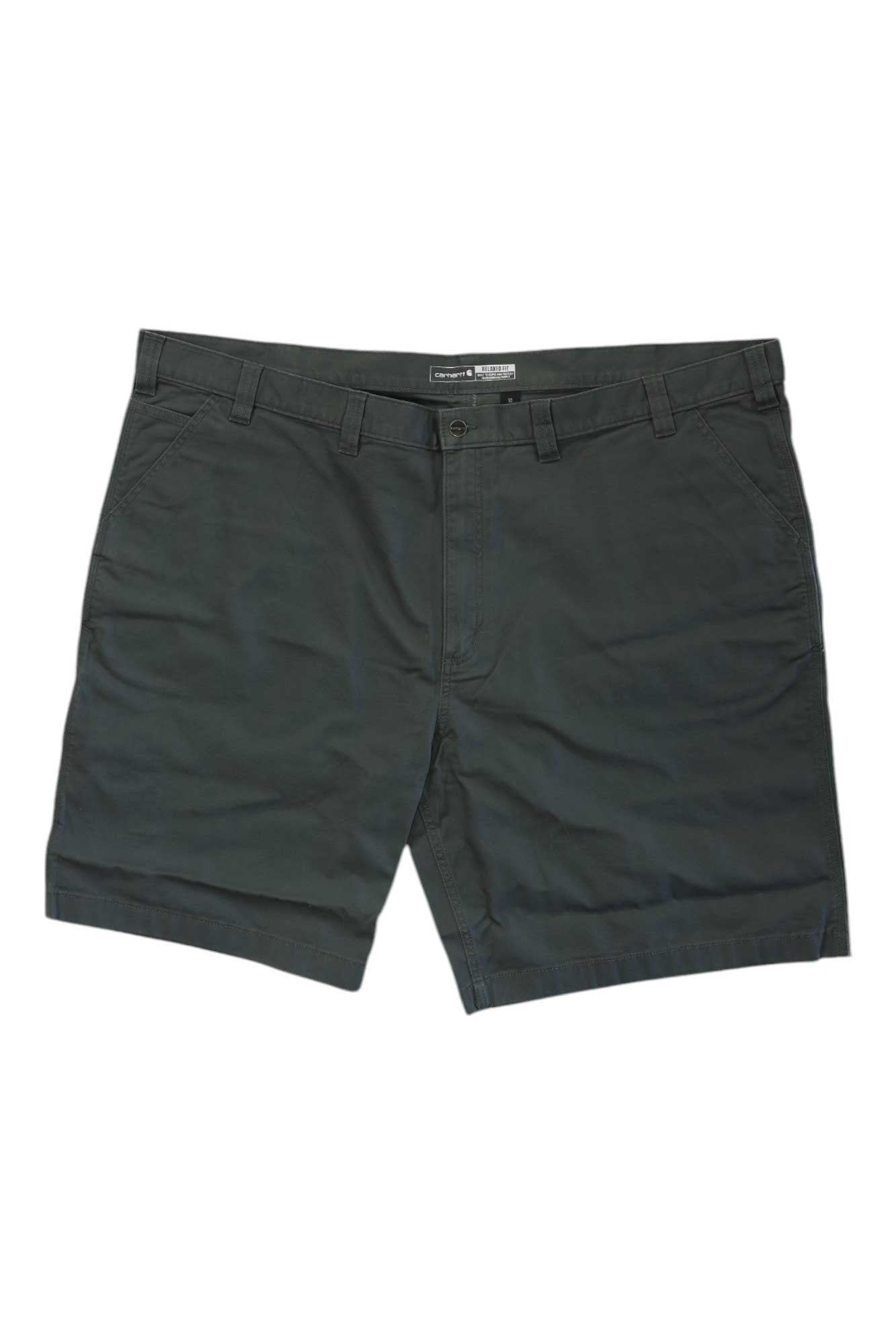 The Carhartt Men's Rugged Flex Relaxed Fit Canvas Work Short in dark green features belt loops, side pockets, and a front button with zipper closure, designed for outdoor work and shown laid flat on a white background.