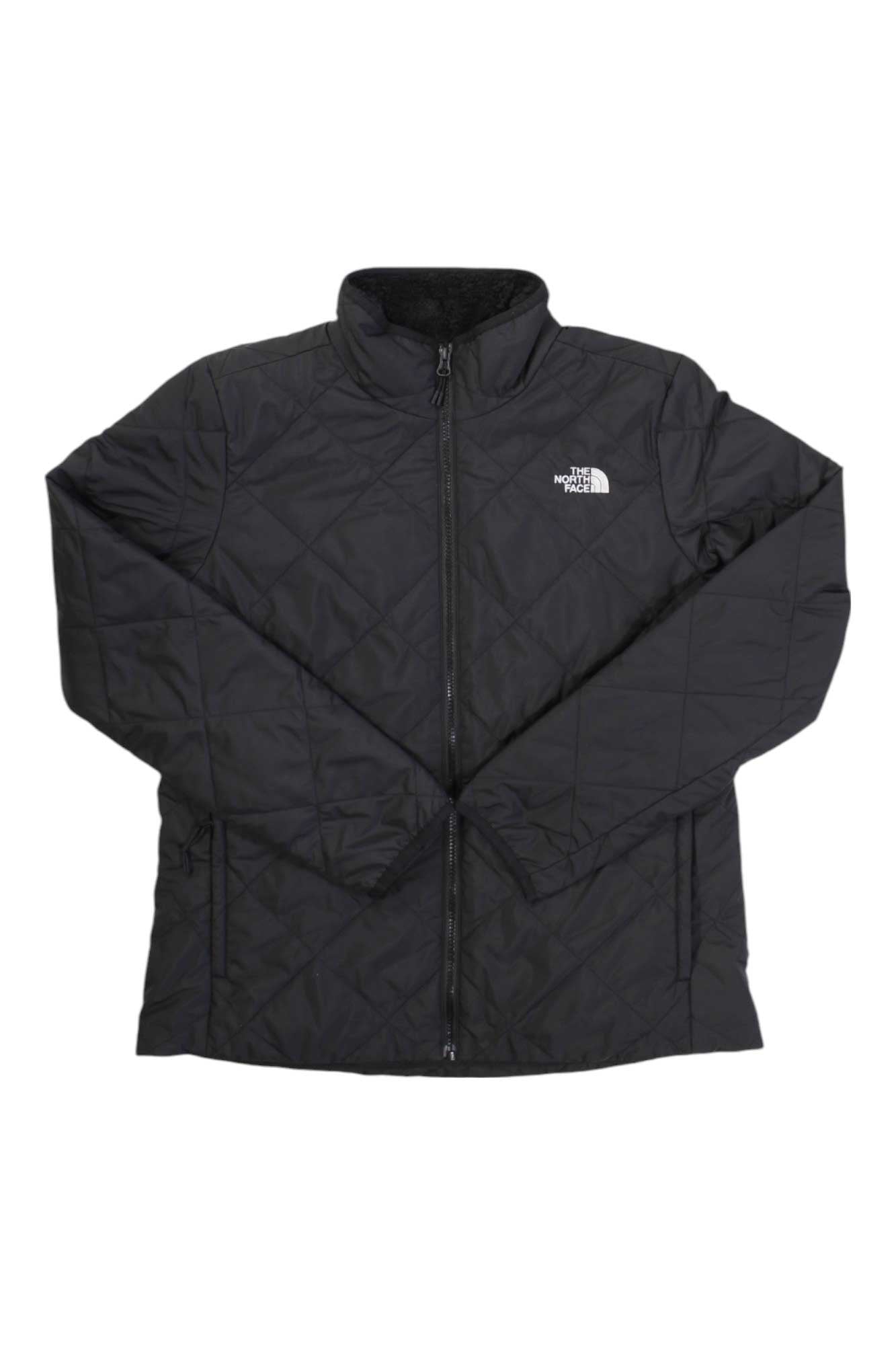 The North Face Womens Shady Glade Insulated Jacket is a black, quilted jacket made from recycled polyester, featuring a front zipper, stand-up collar, and the North Face logo on the left chest. Displayed flat with sleeves crossed.