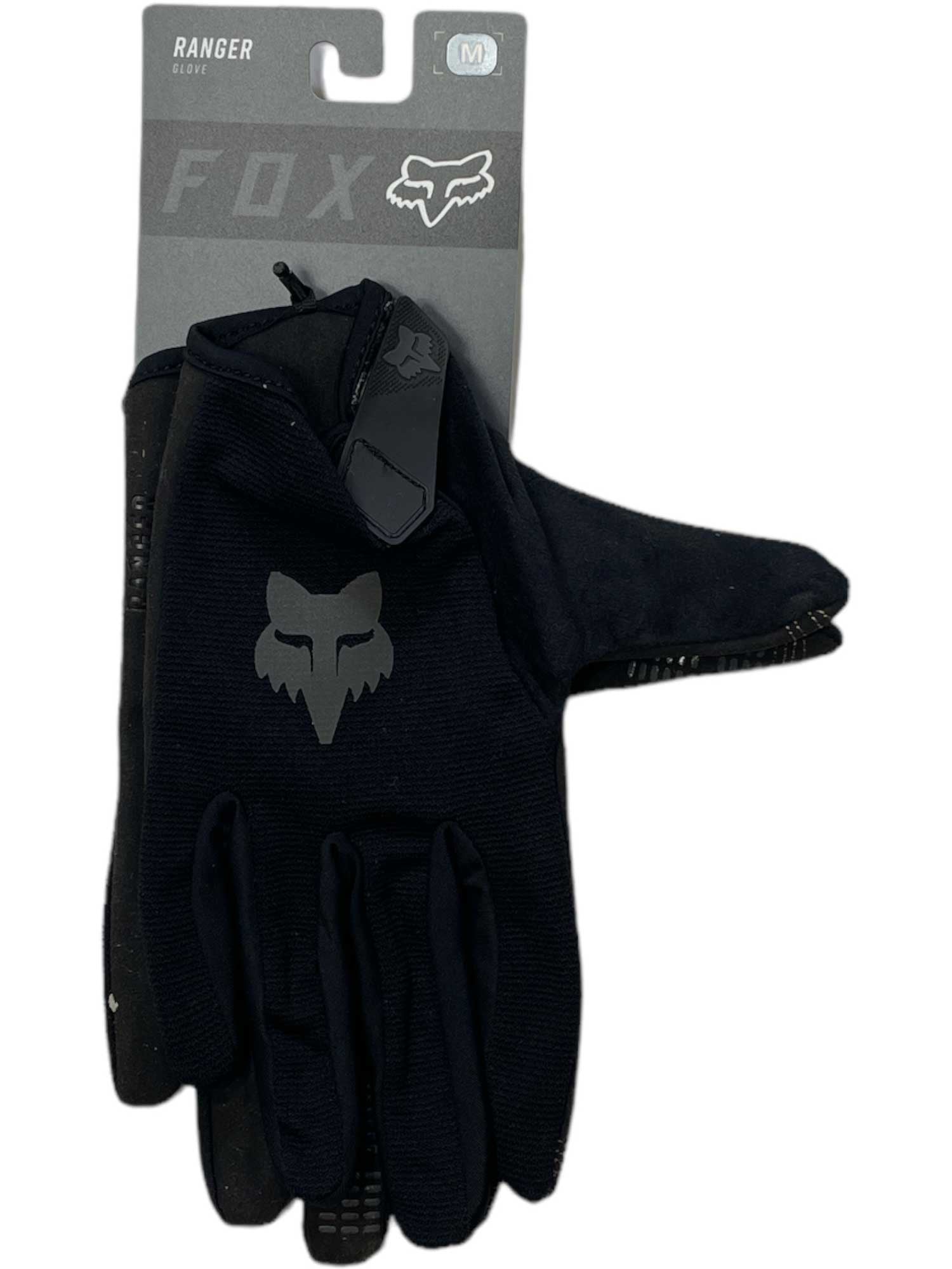 A single Fox Ranger Glove in black, featuring a gray Fox logo and made from 4-way stretch polyester, comes in medium (M) size with "Ranger Glove" labeled on its cardboard packaging.