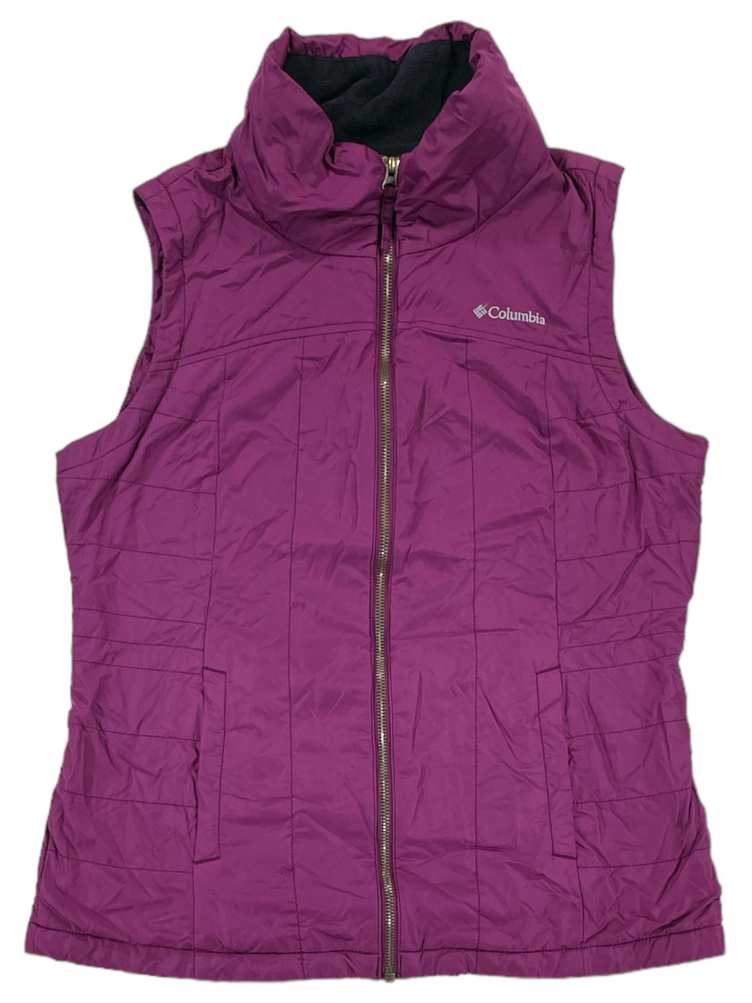 A sleeveless purple Womens Cedar Express Vest with UPF 50, high collar, front zipper, and side pockets is laid flat on a white background.