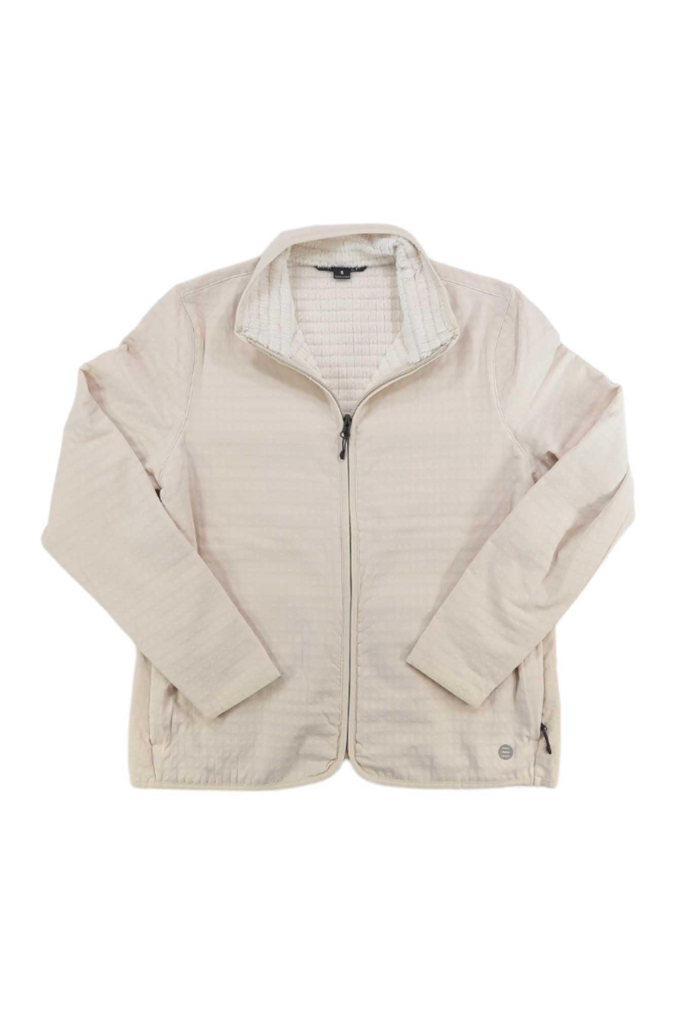 A light beige Free Fly Womens Gridback Fleece Jacket with a stand collar, long sleeves, subtle textured pattern, and two side pockets, displayed flat on a white background for a stylish and comfortable look.