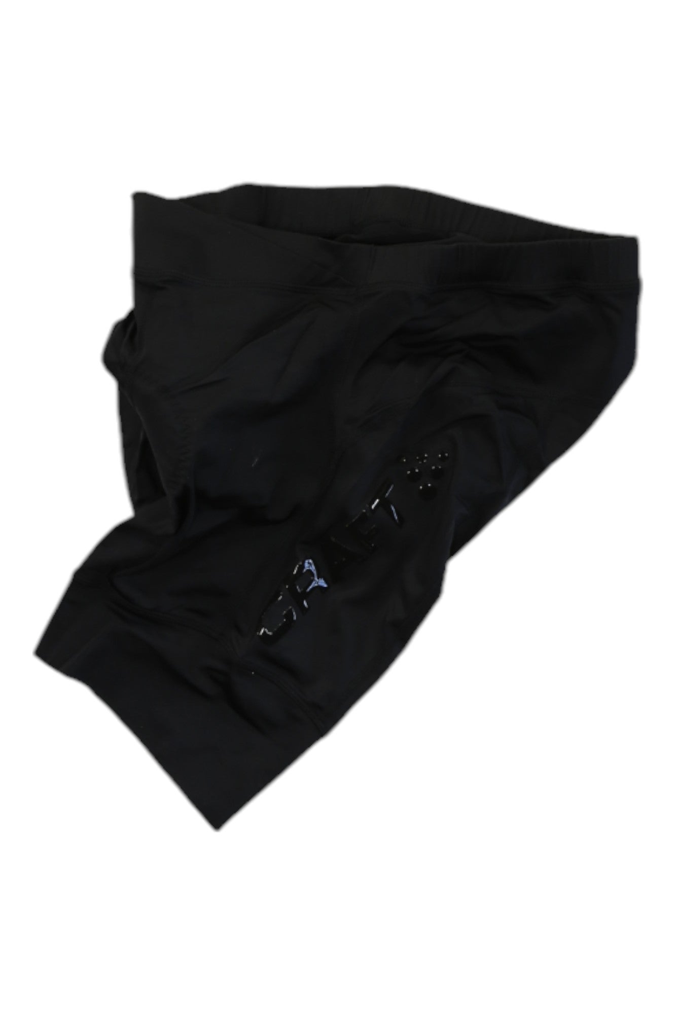 The Craft Sportswear Womens Essence Short in black is shown laid flat on a white background, with shiny detail on one side—ideal for road cycling or bike commuting.