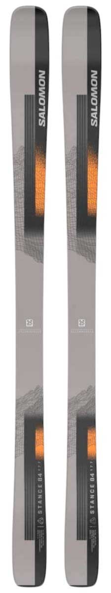 Pair of Salomon Stance 84 skis in dark gray/black with orange accents