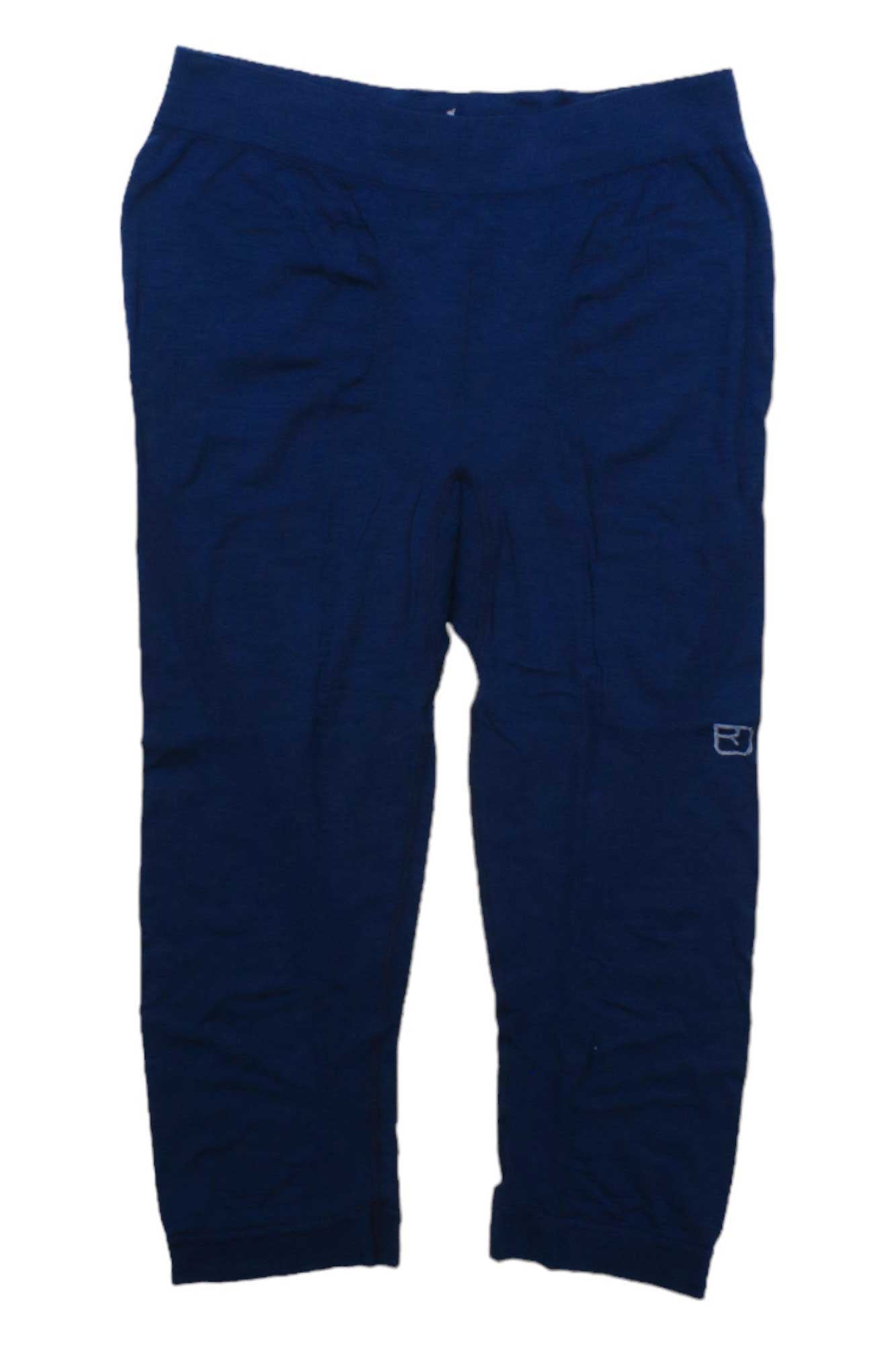 The Ortovox Men's 120 Comp Light Short Pant in dark blue is made from soft merino wool, with an elastic waistband, side pockets, and a small white logo near the knee—ideal for all-mountain skiing. Shown on a white background.