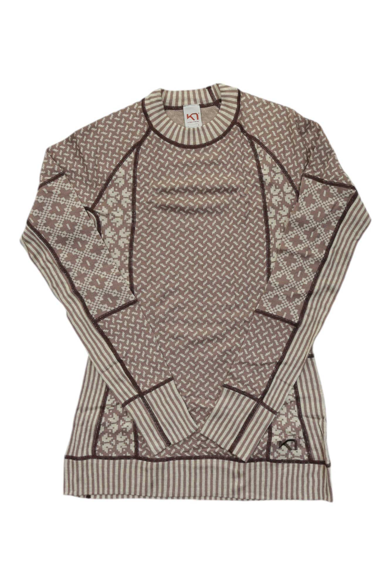 The Kari Traa Womens Smekker LS is a long-sleeve Merino wool baselayer with geometric and floral patterns in brown and beige, striped cuffs, hem, and collar. Odor-resistant sweater shown laid flat on a white background.