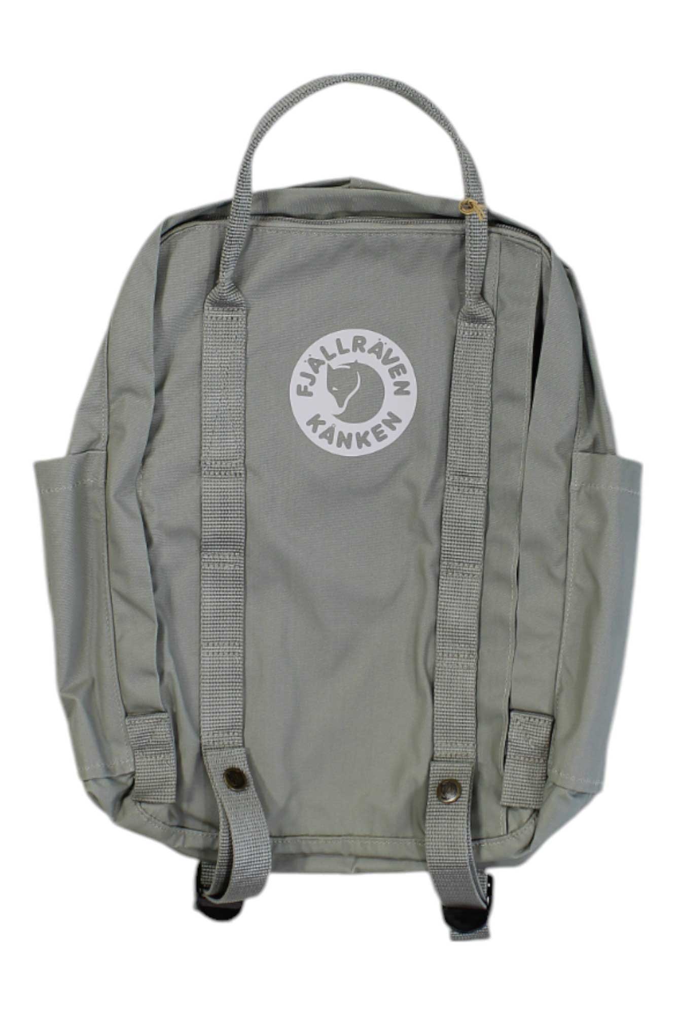 A grey Fjallraven Tree Kanken 16L Backpack seen from the back, with adjustable shoulder straps, side pockets, and a circular fox logo on top—an eco-friendly choice for conscious explorers.