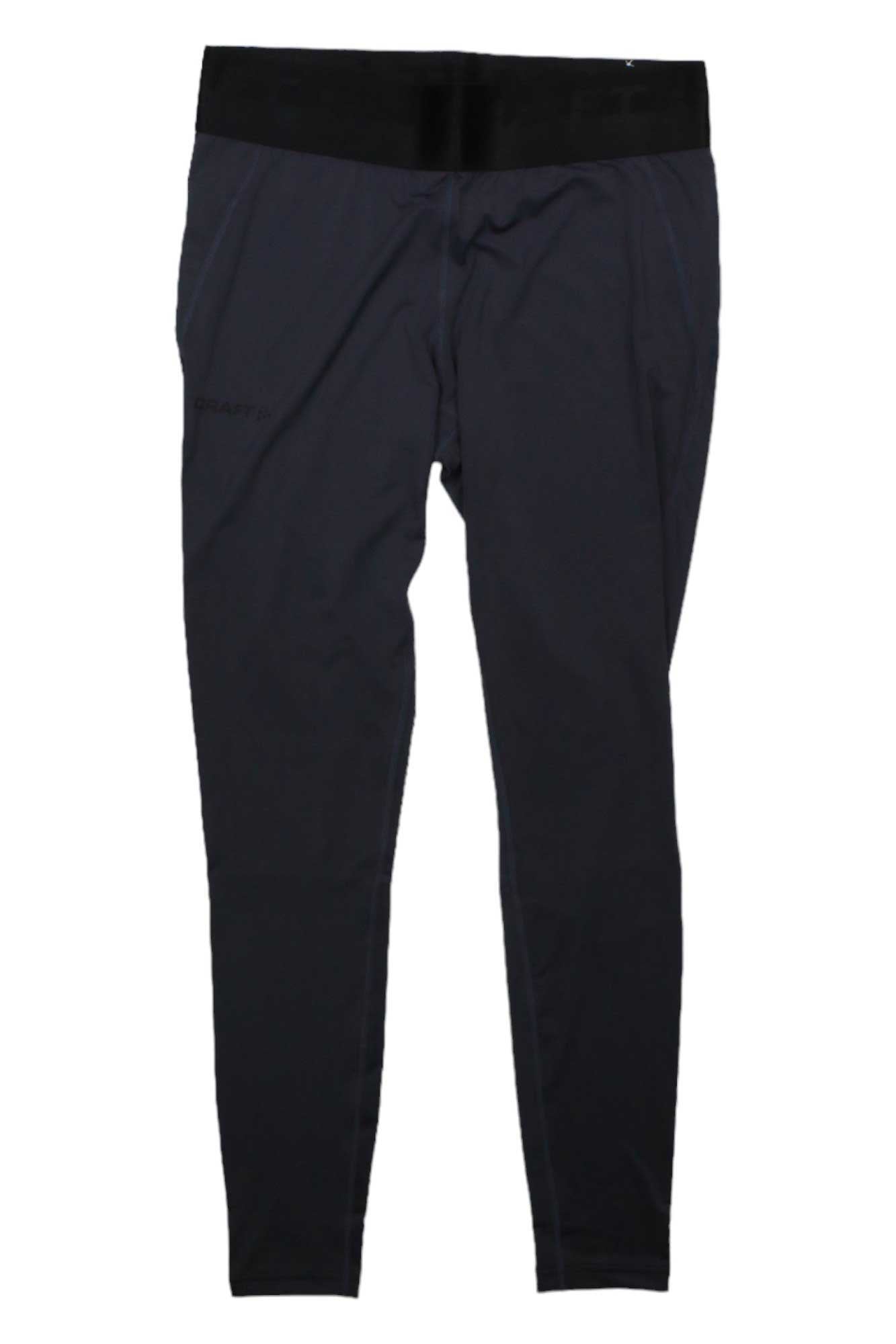The Craft Sportswear Womens Core Essence Tight is a pair of black fitness tights for women, made from recycled polyester with a wide waistband, shown against a white background.