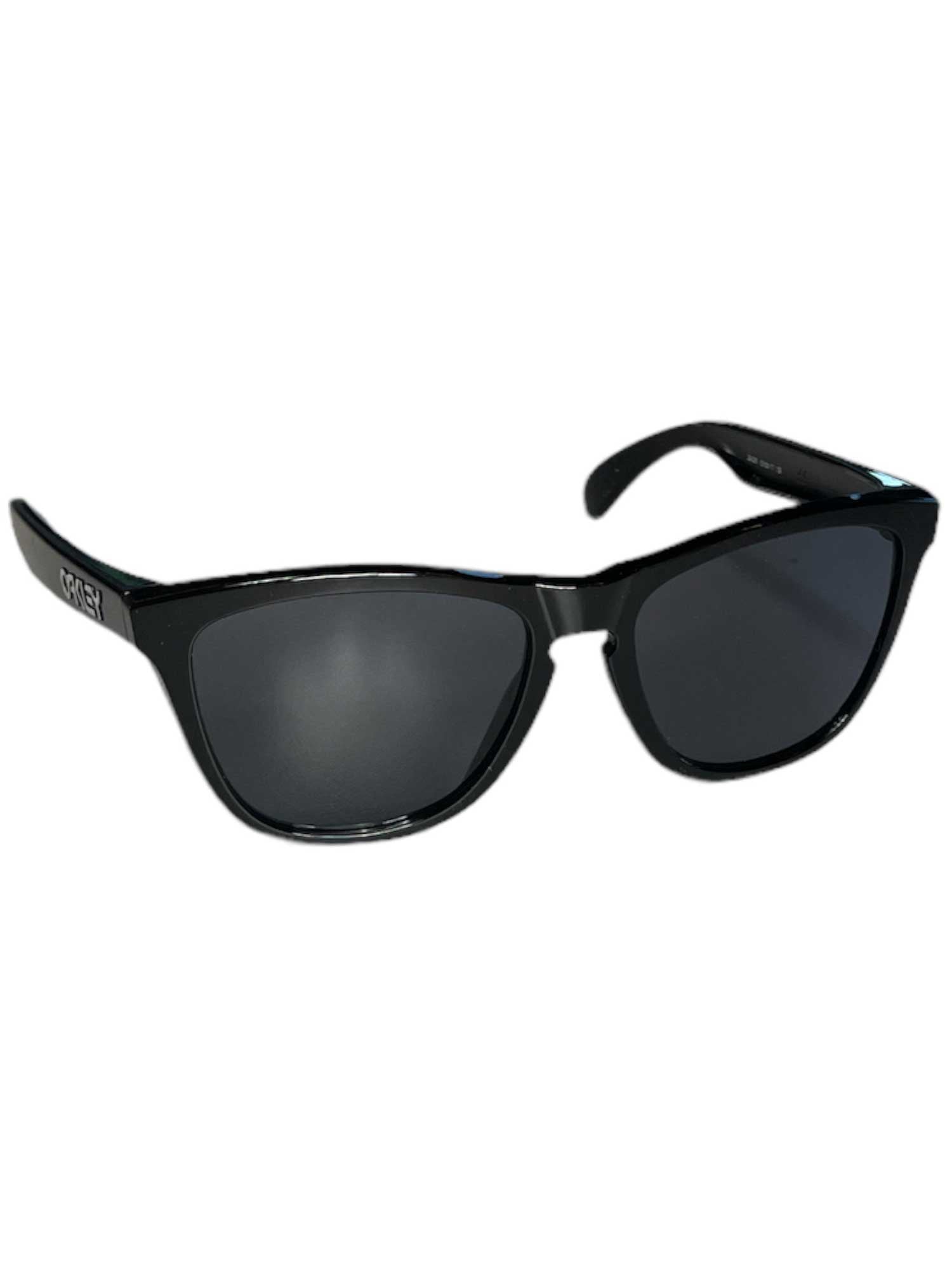 A pair of Oakley Frogskins Sunglasses with black plastic frames and dark Plutonite lenses is displayed against a white background.