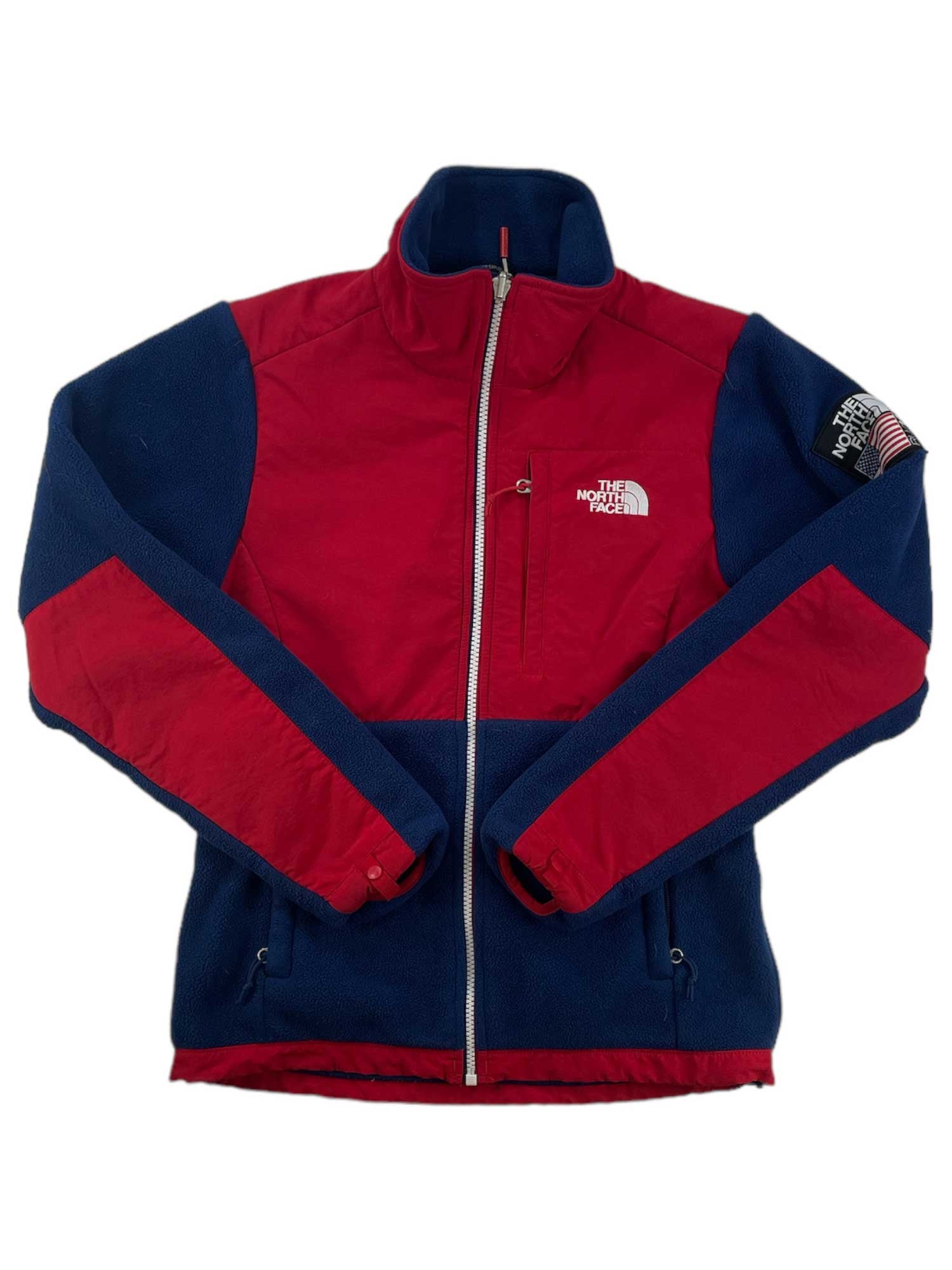 Full-zip jacket with contrasting red and dark blue panels, stand collar, zip front