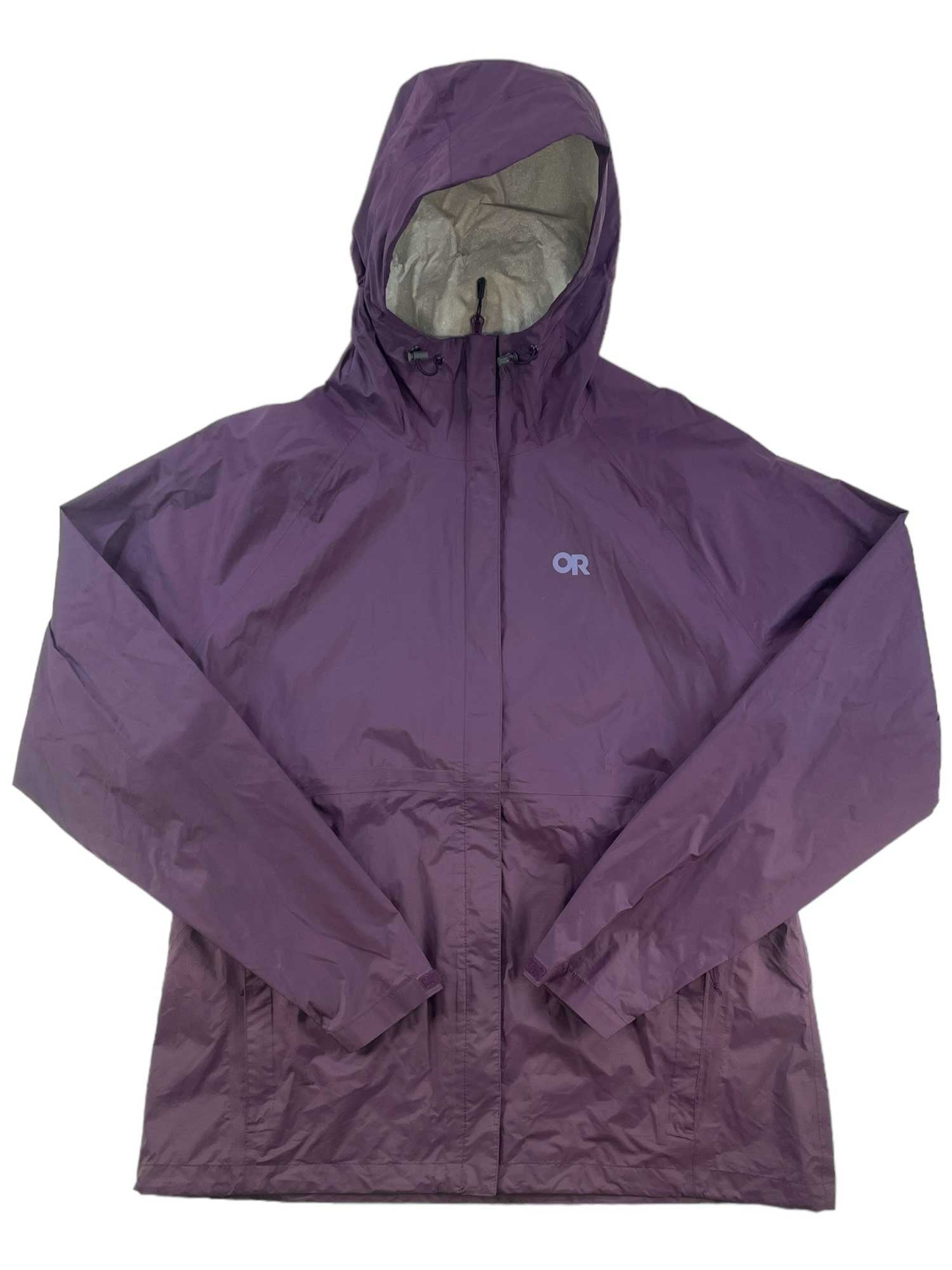 The Outdoor Research Women's Apollo Jacket in purple features a waterproof design, front zipper, long sleeves, loose fit, and OR logo on the left chest—shown laid flat on a white background.