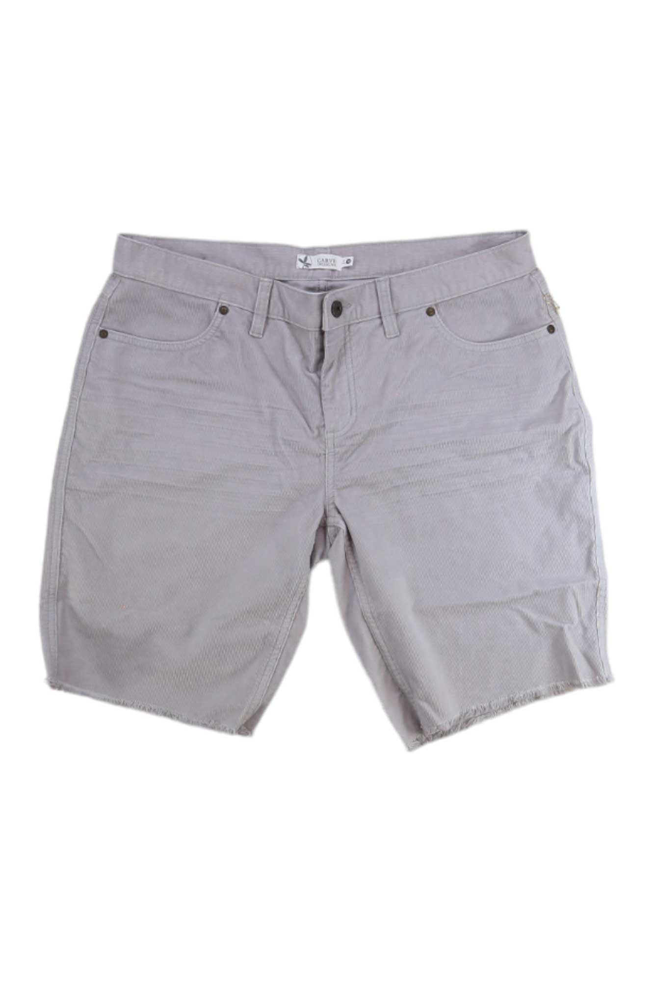 Carve Designs Womens Oahu 10 Inch Short in light gray, made from organic cotton denim, features button-zip closure, front and back pockets, and unfinished frayed hems. Shown on a plain white background.