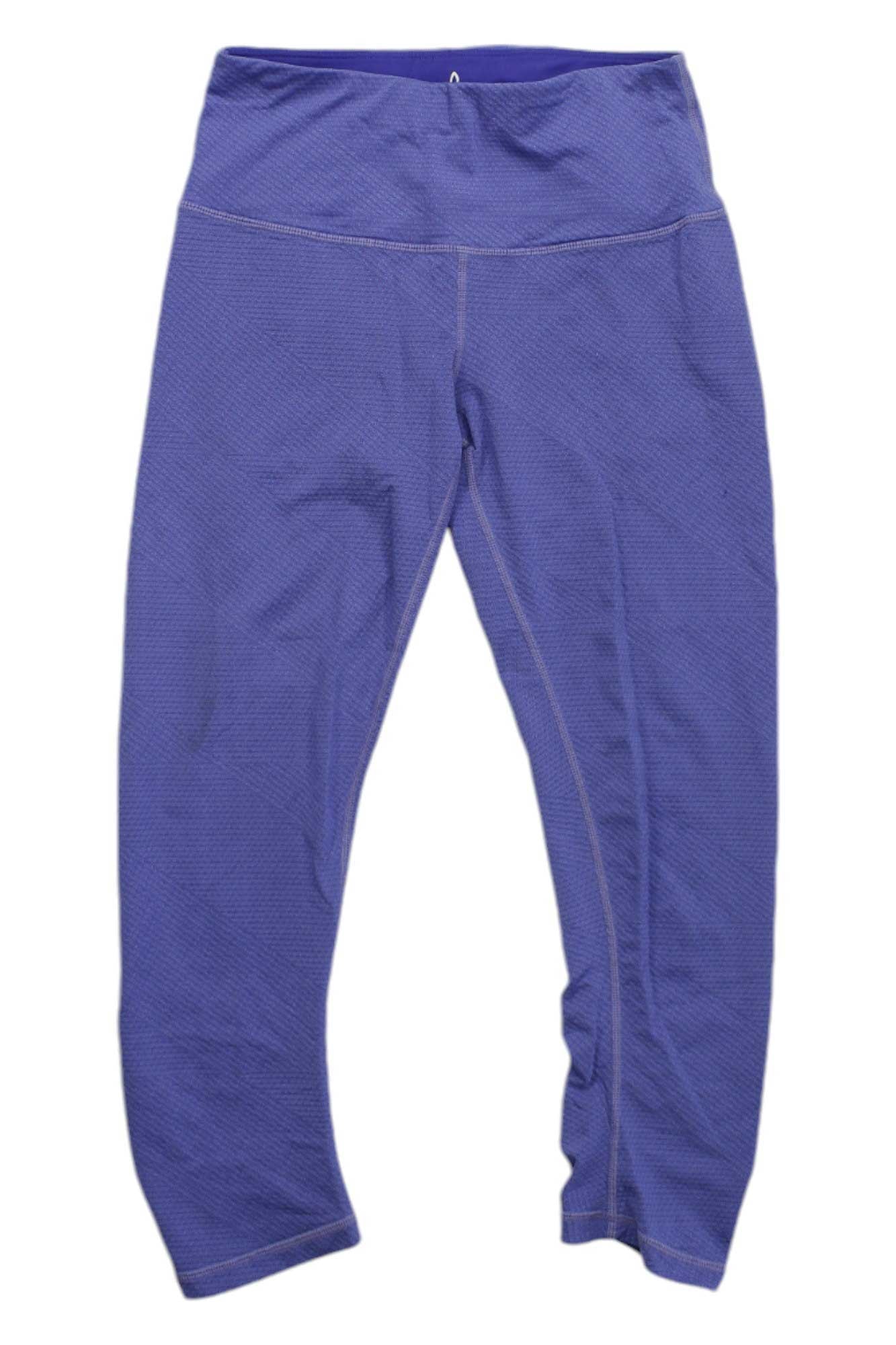 The Prana Womens Misty Knickers, purple moisture-wicking leggings with a textured fabric and high waistband, are shown laid flat on a white background.