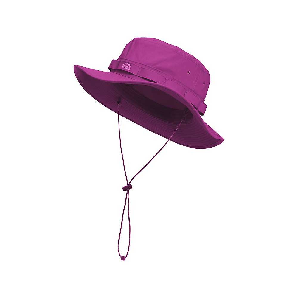 The North Face Class V Brimmer Hat, shown in purple with a wide brim, chin strap, and adjustable drawcord, provides sun protection—ideal for hiking—against a plain white background.
