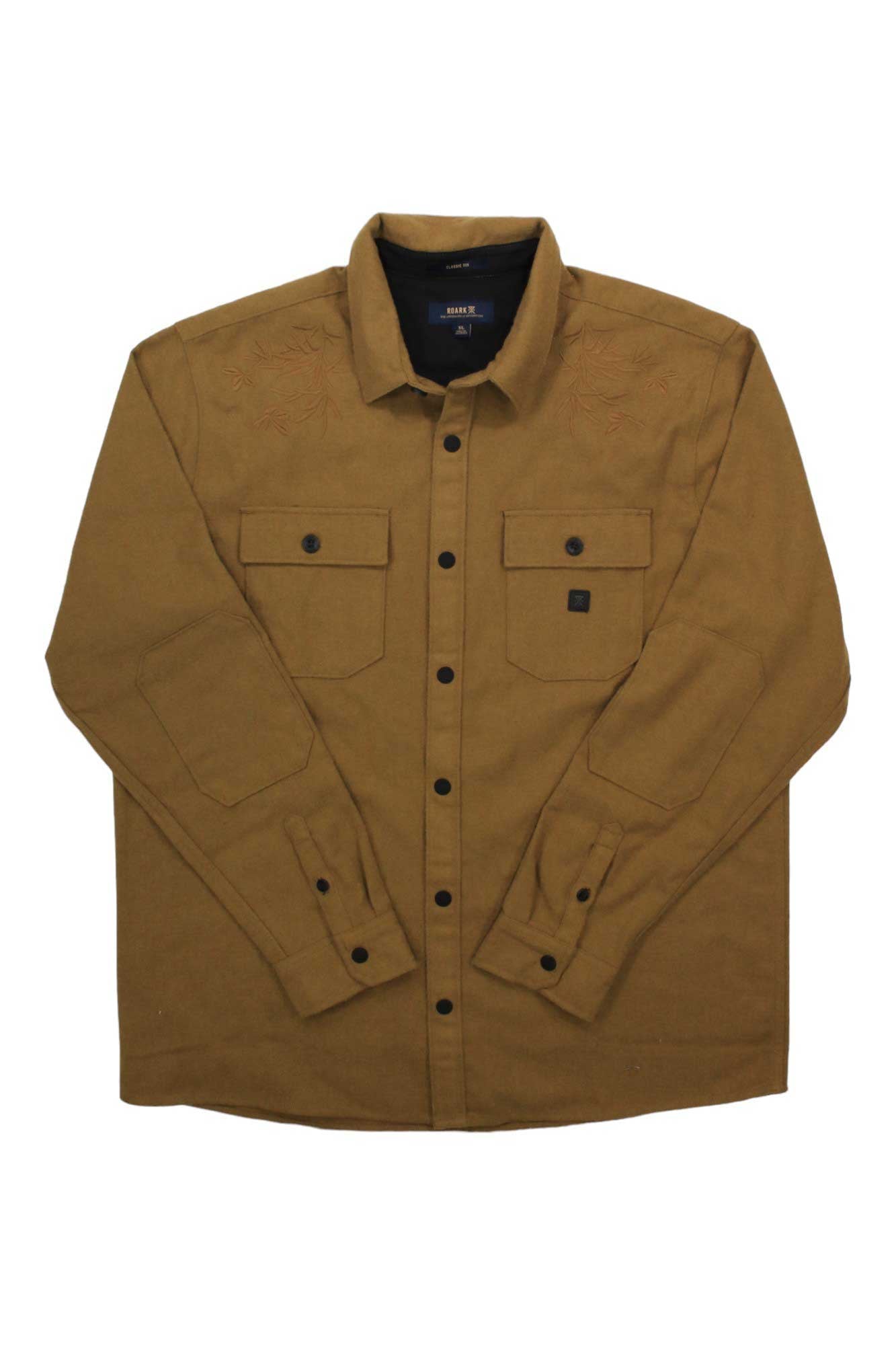 A Roark Men's Nordsman Shirt in a brown wool blend, featuring long sleeves, button-up front, two chest pockets, and subtle shoulder embroidery, is laid flat on a white background.