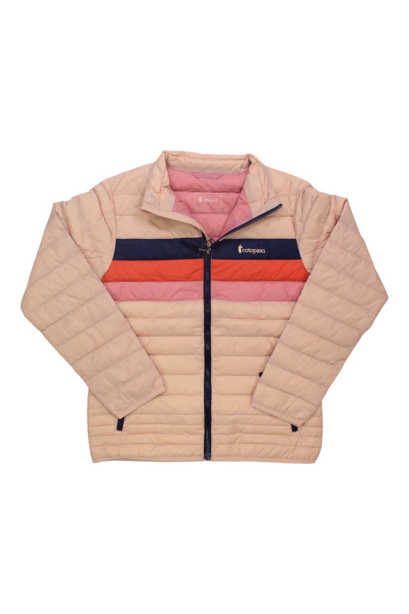 The Cotopaxi Kids' Fuego Down Jacket is a light pink, color-blocked quilted jacket with red and navy chest stripes, lightweight down insulation, a front zipper closure, and the Cotopaxi logo on the left chest.