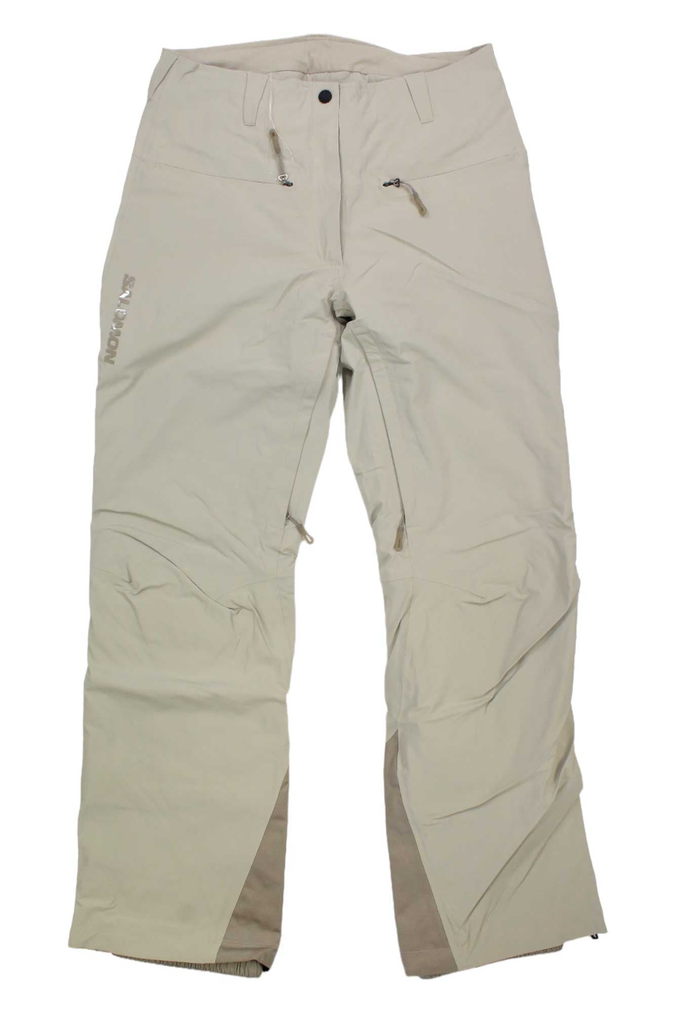 The Salomon Women's Brilliant Pant in beige features zipper pockets, reinforced knees and ankles, and PrimaLoft insulation for warmth. Displayed flat on a white background, these insulated ski pants also show a logo on the left thigh.