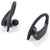 Black wireless sport earbuds with ear hooks, shown with two charging case parts