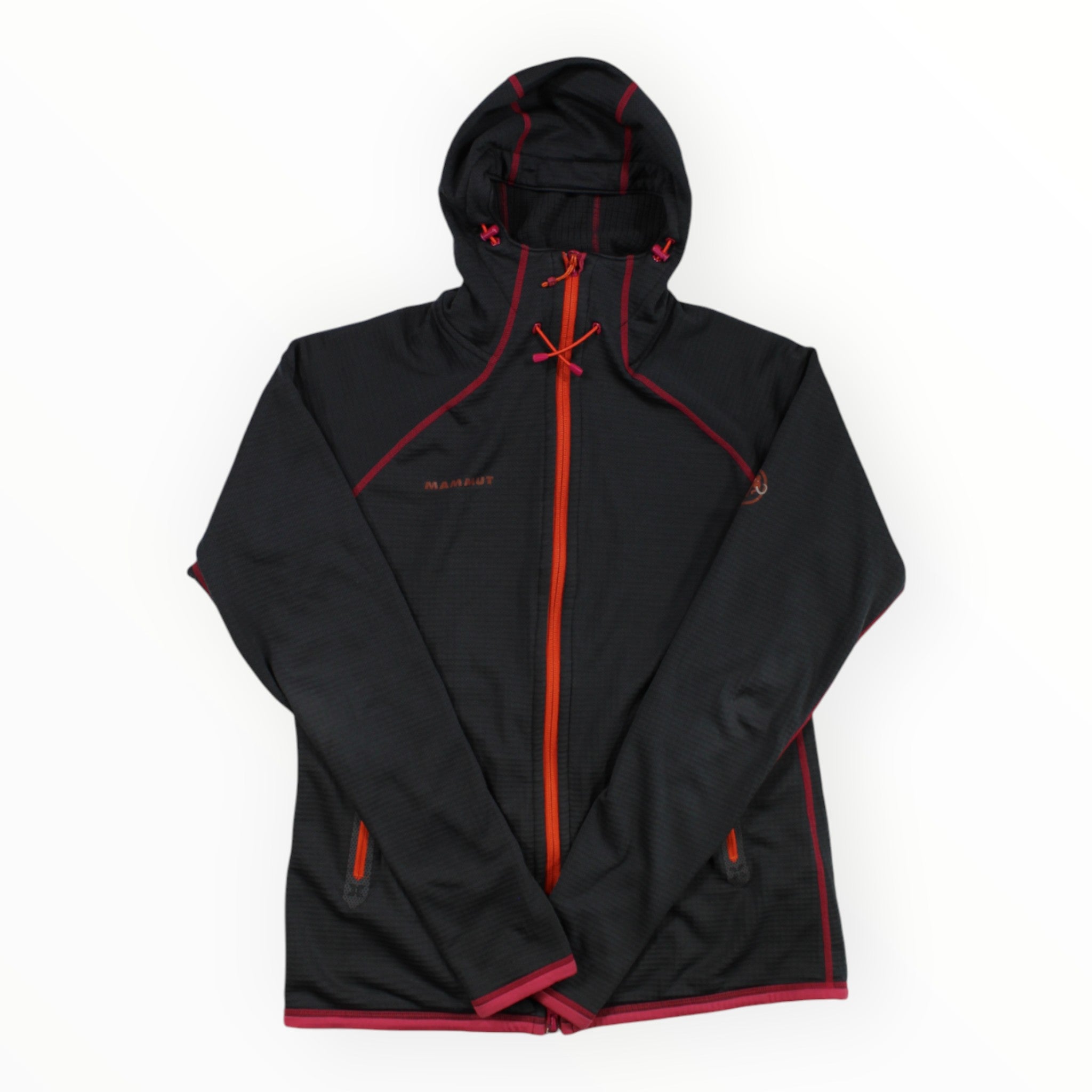 The Mammut Womens Schneefield Fleece Jacket is a black hooded outdoor jacket with red trim and an orange zipper. Made with Polartec thermal fleece, it features two zippered side pockets and a subtle chest logo, shown flat on a white background.