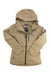 The Burton Women's AK GTX Upshift Jacket is a tan, waterproof GORE-TEX jacket with a hood, front zipper, long sleeves, and features the [ak] logo and Burton branding on the left chest.