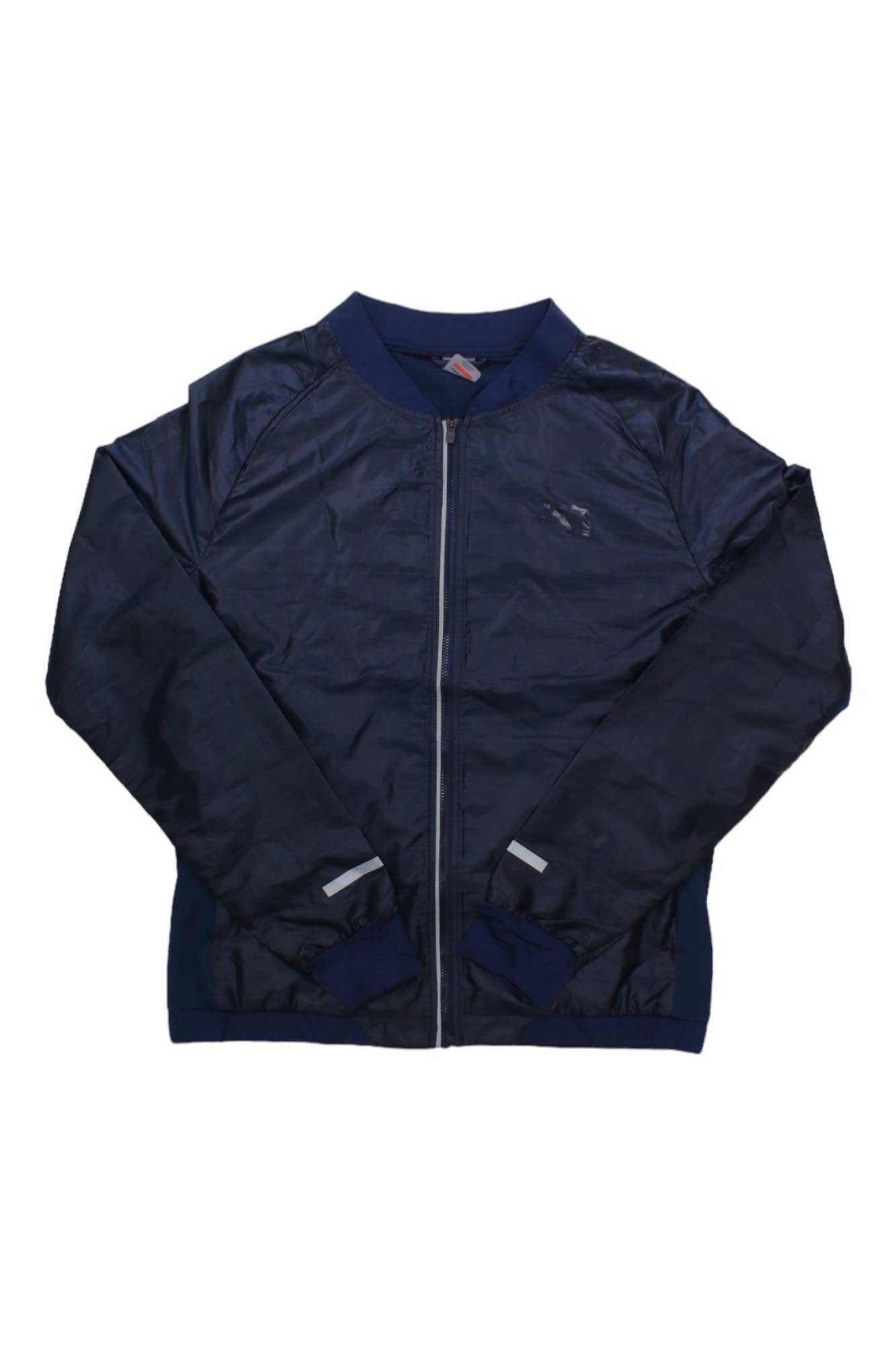 The Kari Traa Women's Sigrun Jacket is a navy blue lightweight fitness jacket with a zip-up front, long sleeves, and ribbed cuffs and collar, shown on a plain white background.