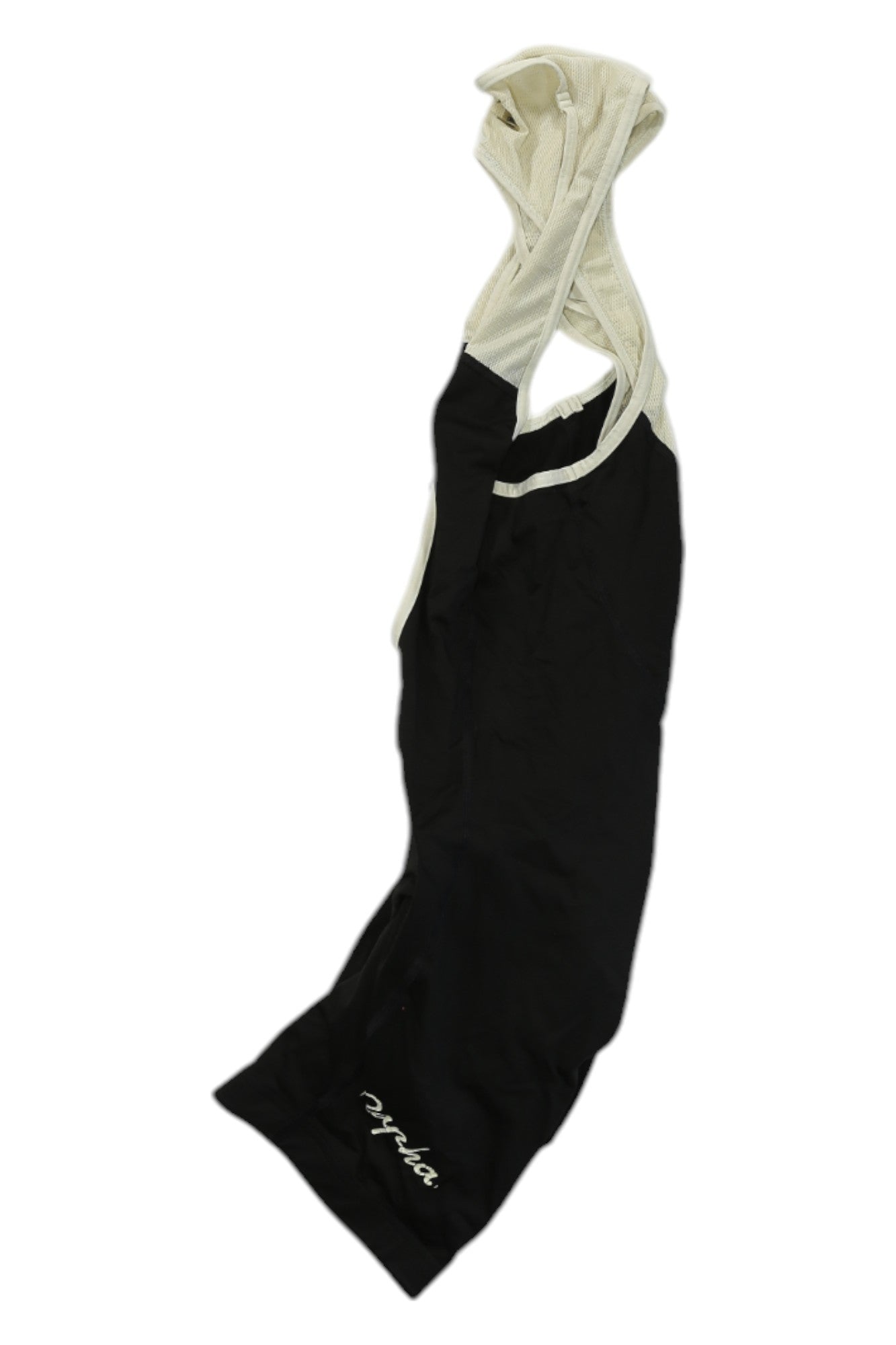 The Rapha Classic Bib Shorts II, in black and white with shoulder straps and 'Rapha' in white on the lower leg, are made from recycled fibers and displayed laid flat on a white background.