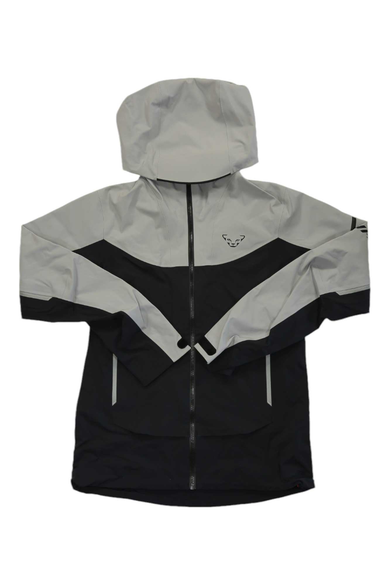 The Dynafit Womens Beast Hybrid Jacket features a color-block design with light gray on the top and sleeves, black on the lower half, a helmet-compatible hood, full front zipper, and a small logo on the left chest.