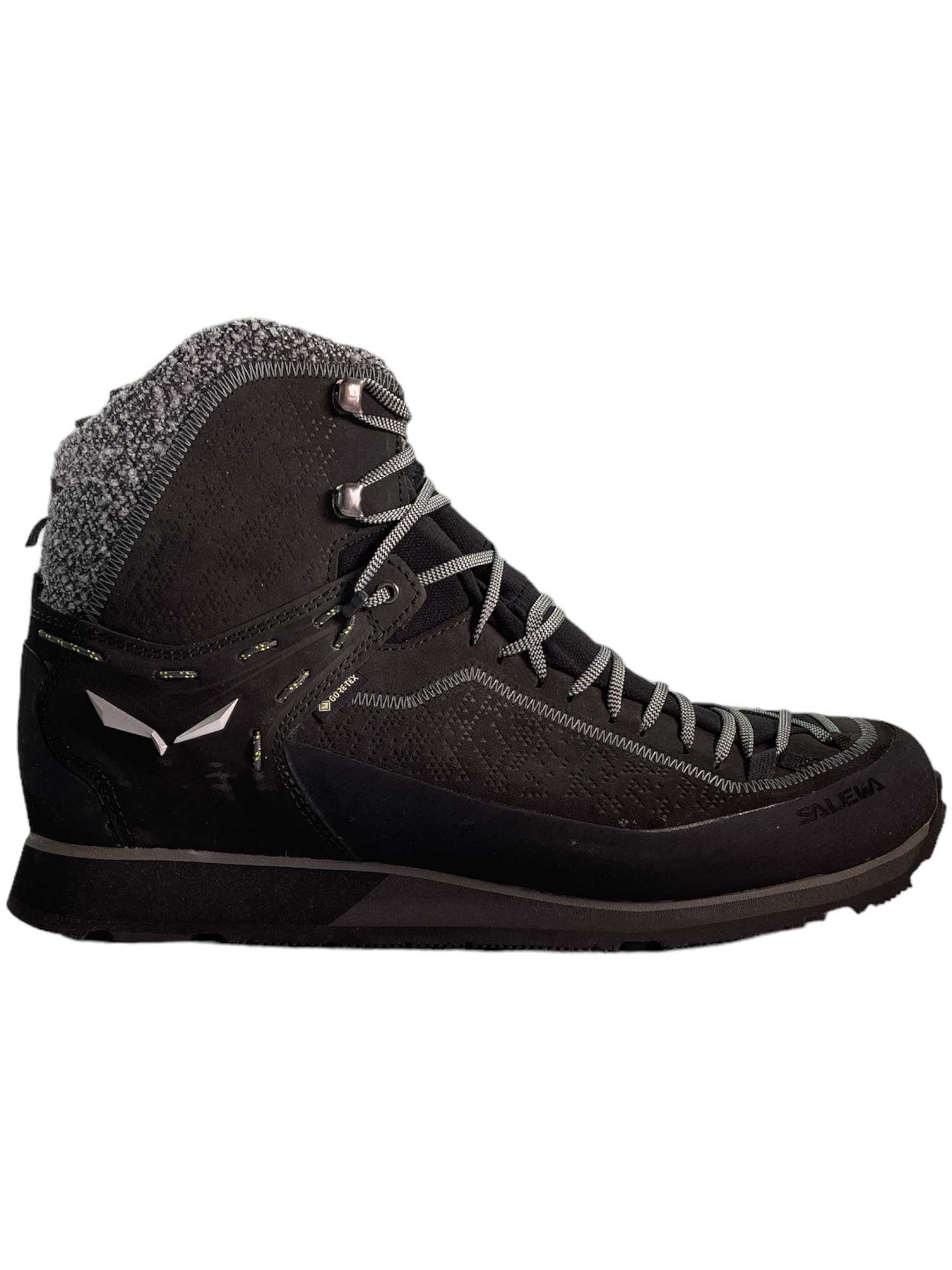 The Salewa Men's MTN Trainer 2 Winter GTX Boot is a black high-top winter hiking boot with gray laces, a textured gray ankle collar, and a rugged Vibram Arctic Grip sole, shown in side profile on a white background.