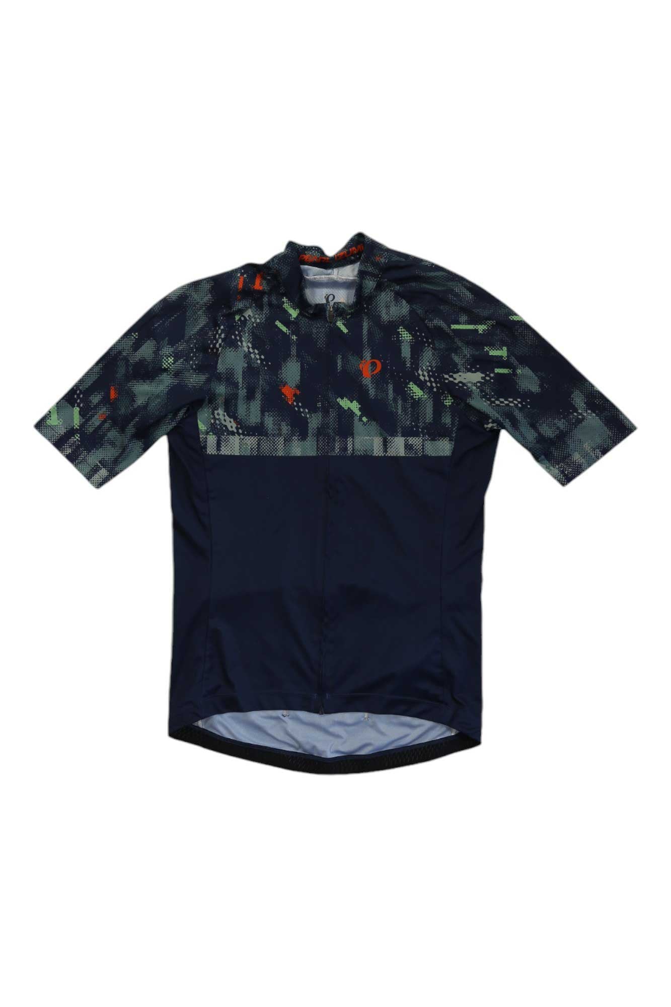 The Attack Jersey is a men’s road cycling jersey with a dark blue base and green-orange digital camo on the upper chest, shoulders, and sleeves. It features a fitted shape, full front zipper, and is made from recycled polyester.