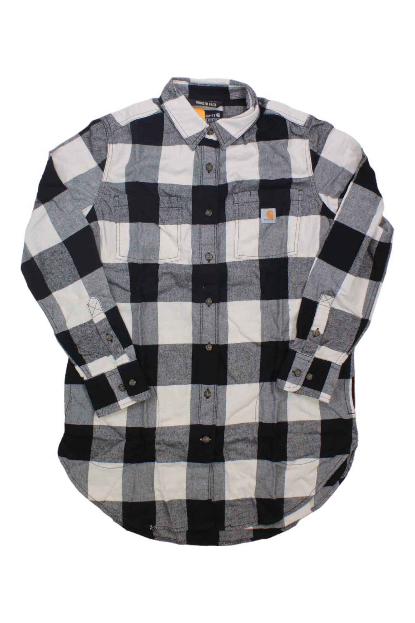 The Carhartt Womens Rugged Flex Relaxed Fit Midweight Flannel LS Plaid Tunic is a black and white checkered, long-sleeve shirt featuring two chest pockets, button closures, and stretch for comfort; shown laid flat on a white background.