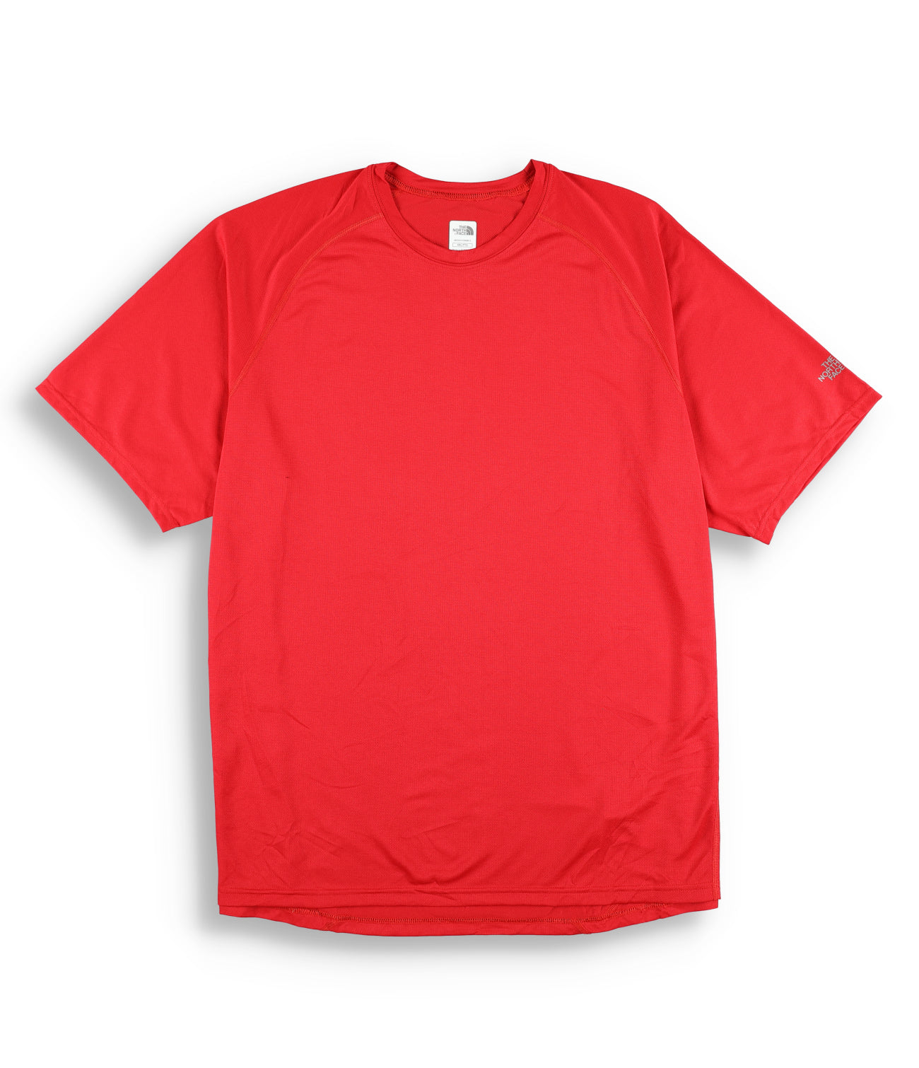 The North Face Men's Flashdry Short Sleeve Shirt, in solid red with a crew neckline and no visible logos or patterns, is laid flat on a white background. It draws inspiration from moisture-wicking designs like The North Face Vapor Wick.