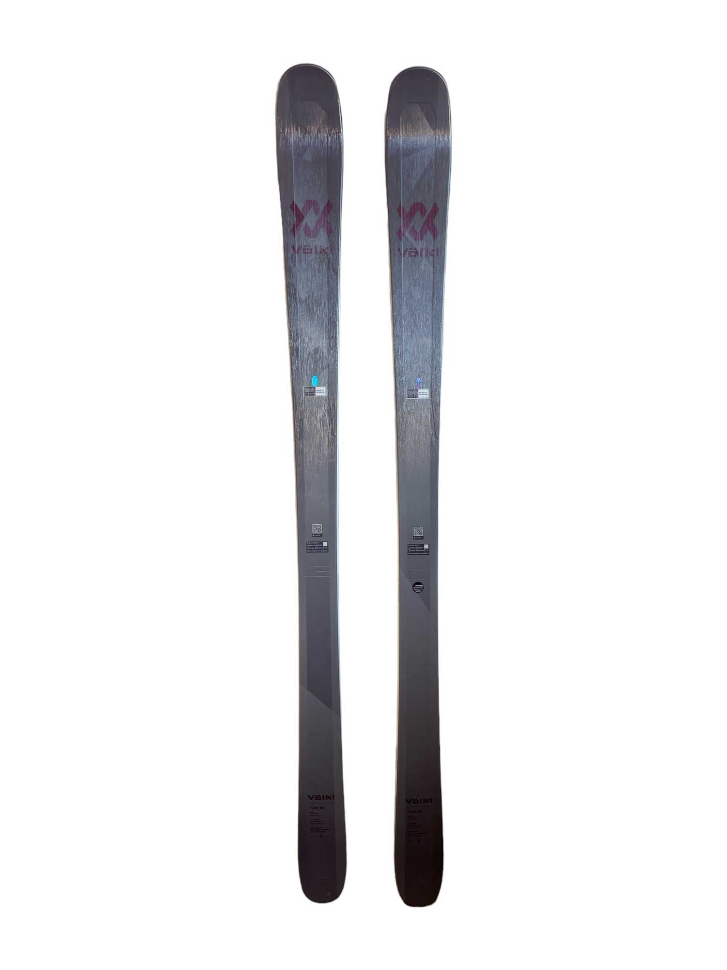 The Volkl Yumi 80 Ski, shown in gray and black with top branding, is designed for women’s all-mountain skiing and is displayed side by side on a white background.