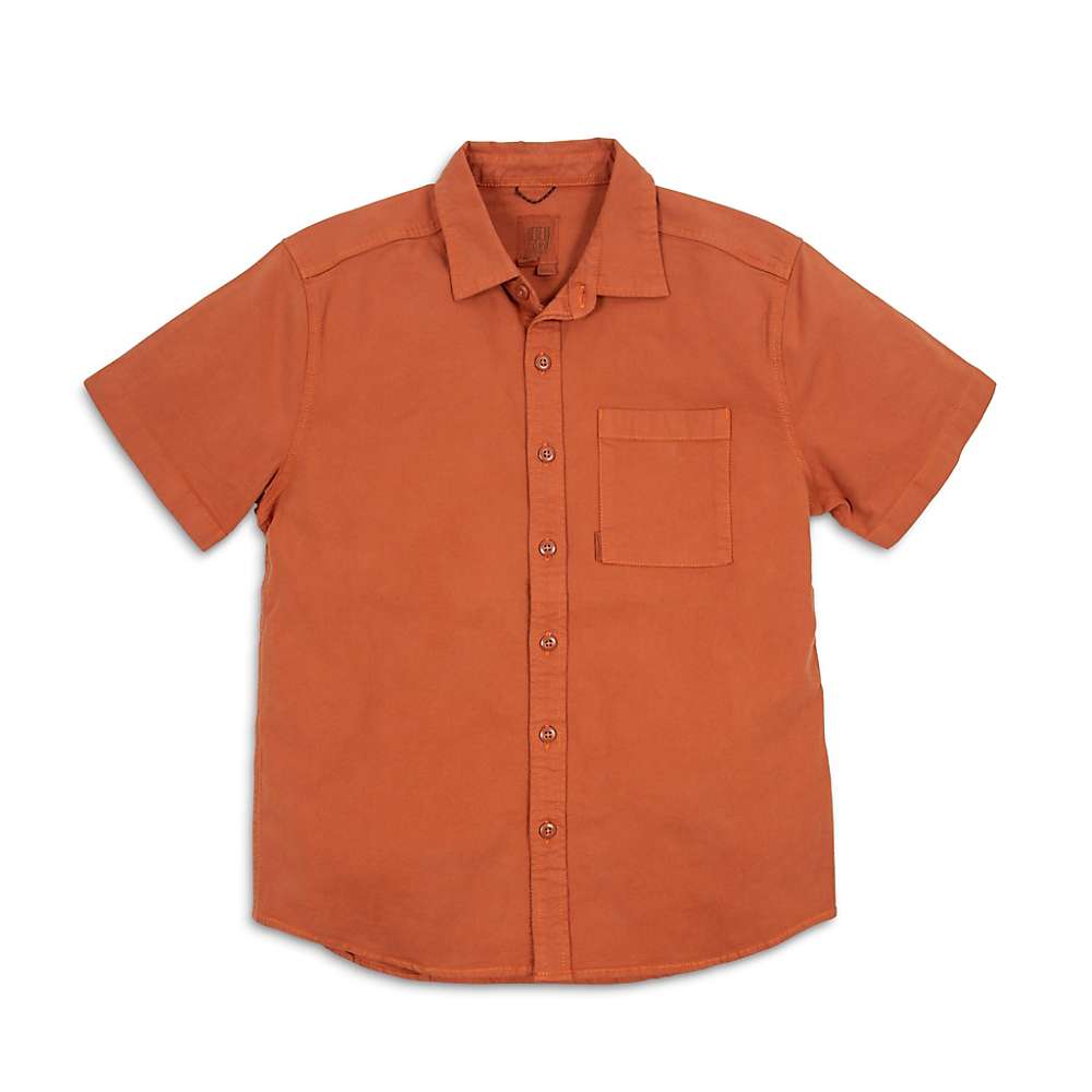 The Topo Designs Men's Brick Dirt SS Shirt in size Small is a short-sleeve, button-up organic cotton shirt in solid burnt orange with a single chest pocket, shown laid flat on a white background.