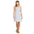 A woman in the Sherpa Women's Neha Dress - Large Alloy Leaf, a light blue sleeveless UPF 40 dress, smiles with her head turned to the side, wearing sandals against a plain white background.