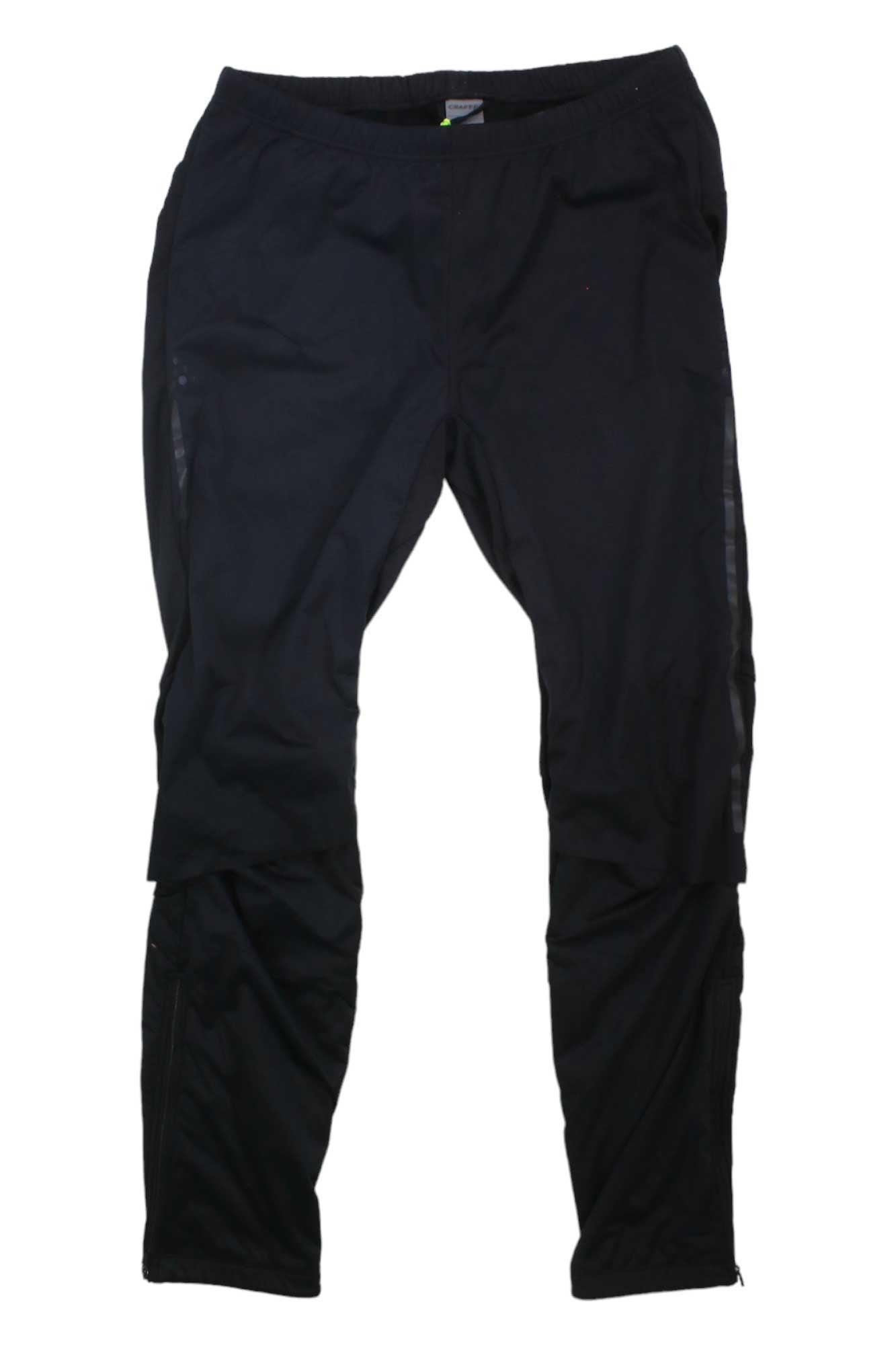 The Craft Sportswear Men’s Adv Nordic Training Pant in black features a slim fit, elastic waistband, and subtle seam details—ideal for men's sportswear. Laid flat on a white background.