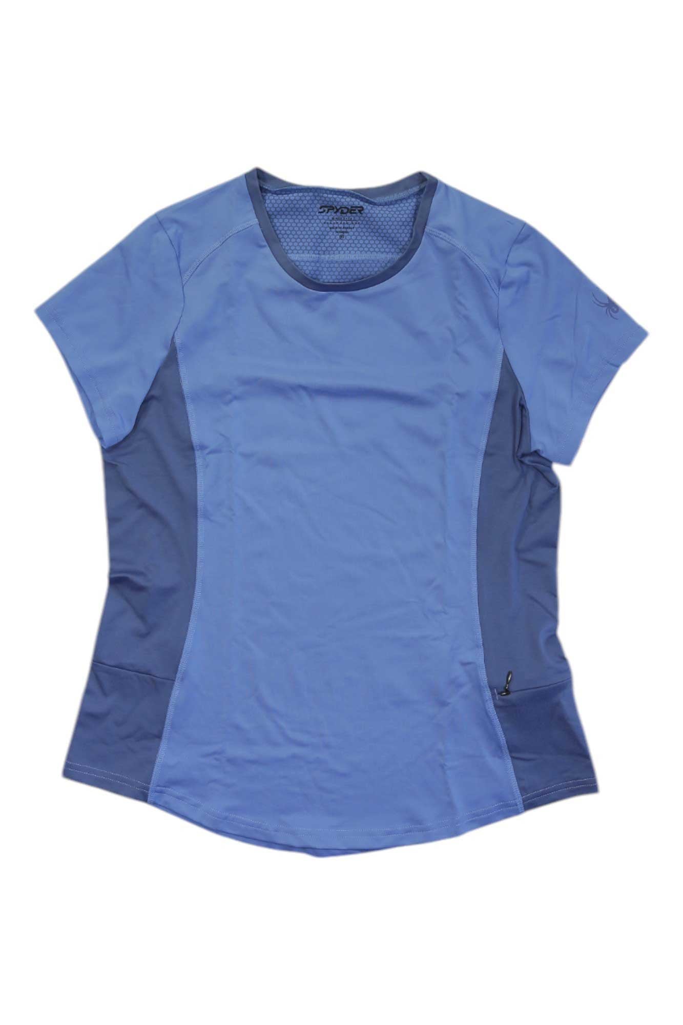 The Spyder Womens Arc Graphene Tech Shirt is a light blue, short-sleeved athleisure top featuring darker blue side panels, a round neckline, and a small zippered pocket near the right hem for stylish comfort during any activity.