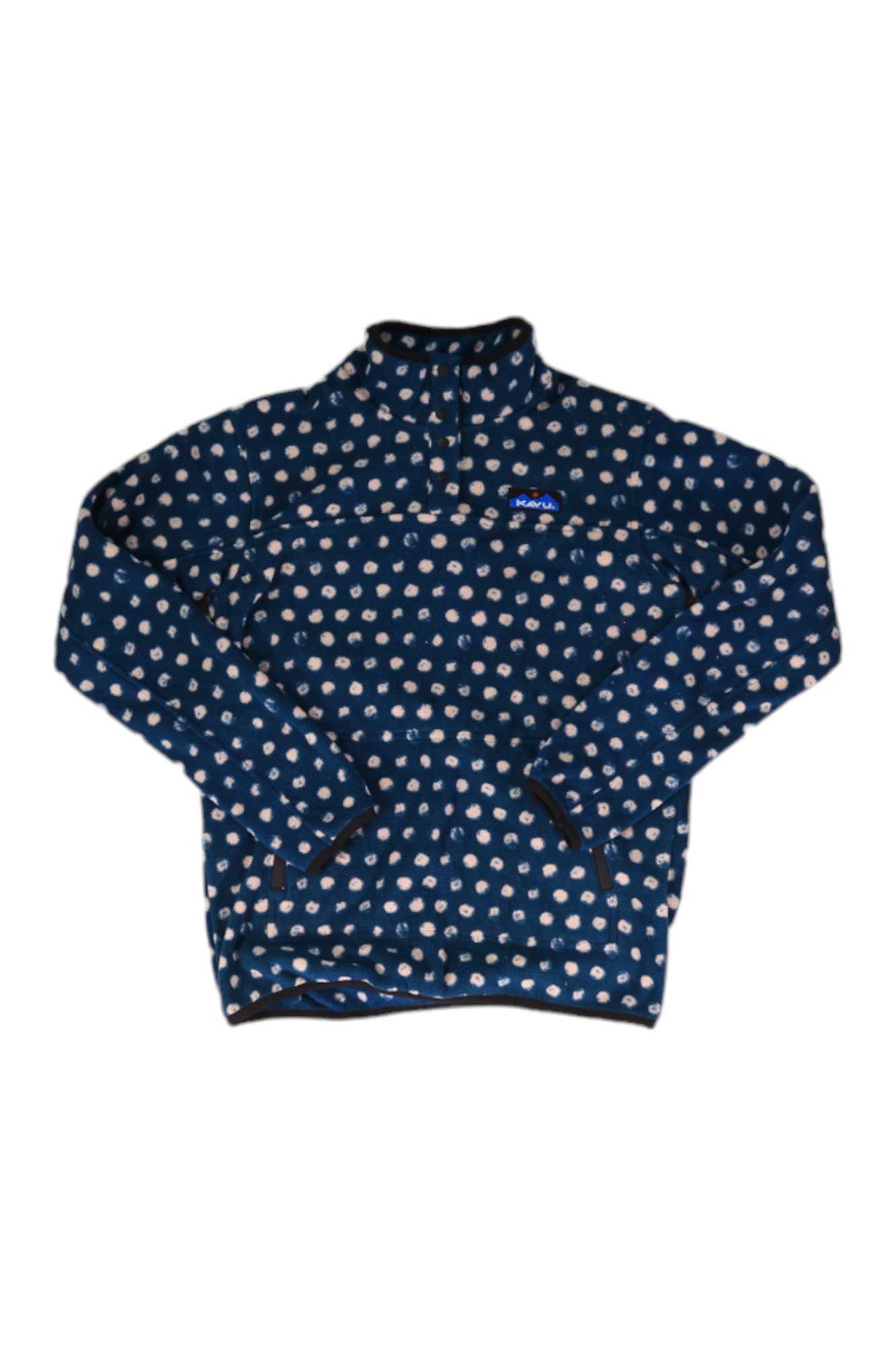 The KAVU Womens Cavanaugh Pullover is a blue polyester fleece with white polka dots, long sleeves, and a high collar, shown flat on a white background. Ideal for cozy style and comfort as a women's travel pullover.