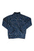 The KAVU Womens Cavanaugh Pullover is a blue polyester fleece with white polka dots, long sleeves, and a high collar, shown flat on a white background. Ideal for cozy style and comfort as a women's travel pullover.
