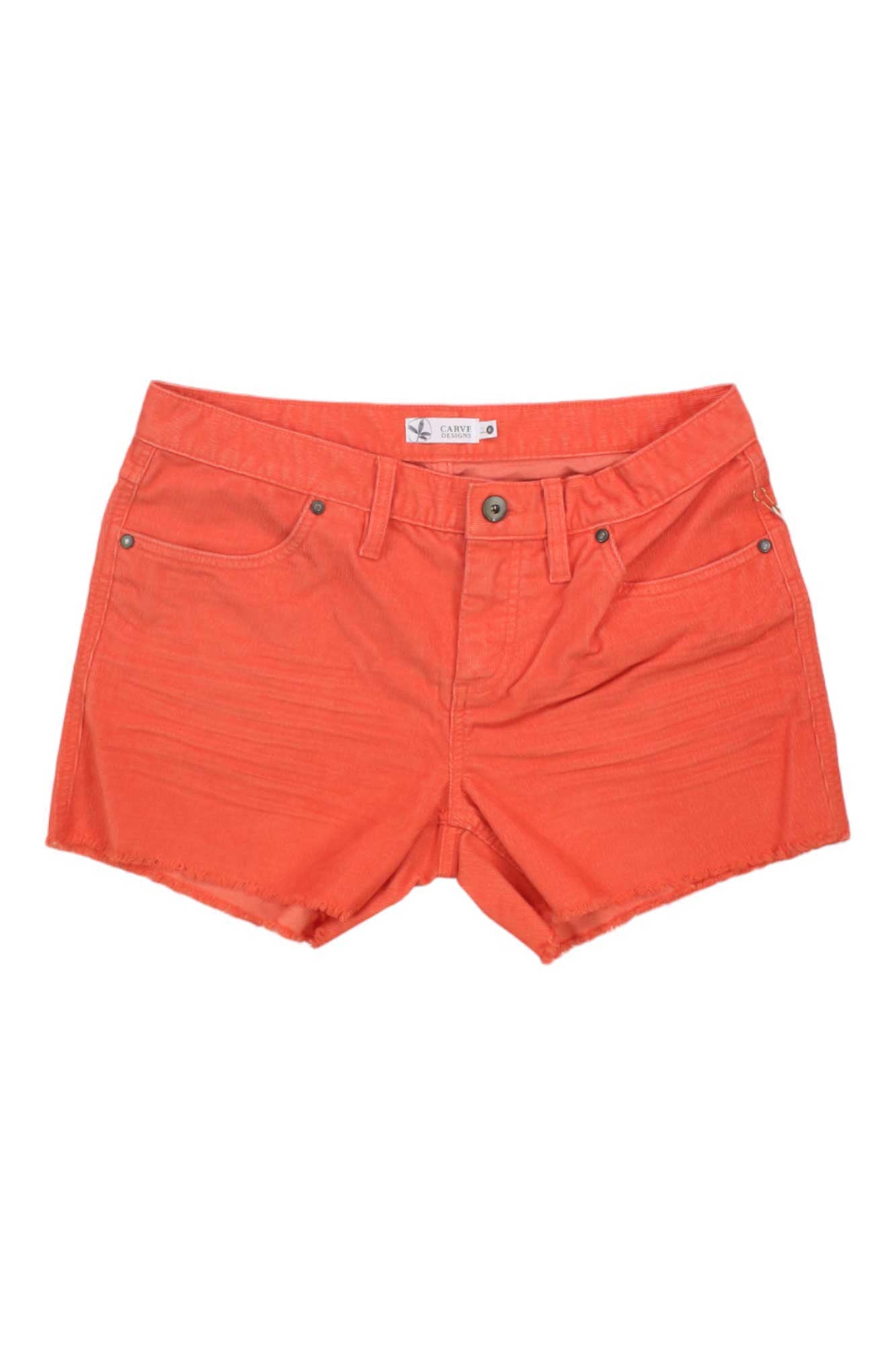 The Carve Designs Women's Oahu 4 Inch Short is a bright orange slim-fit style with front and back pockets, raw-cut hems, and a button-zip closure.