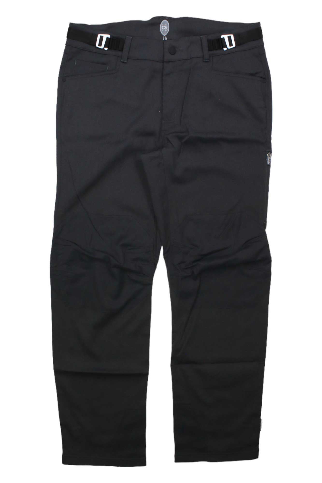 The Club Ride Men's Gold Rush Pant, black mountain biking pants with adjustable side buckles, front button closure, and straight legs, is shown laid flat on a white background.
