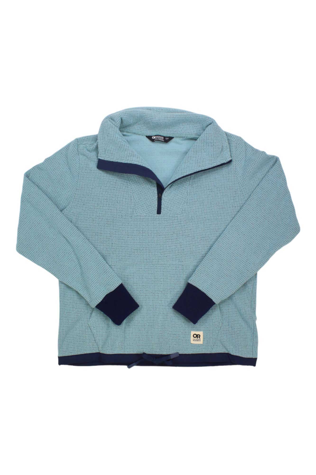 The Outdoor Research Women's Trail Mix Quarter Zip Pullover features light blue fabric, a half-zip collar, dark blue cuffs and hem, subtle grid texture, white logo patch by the hem, moisture wicking fabric, and UPF 30 protection.