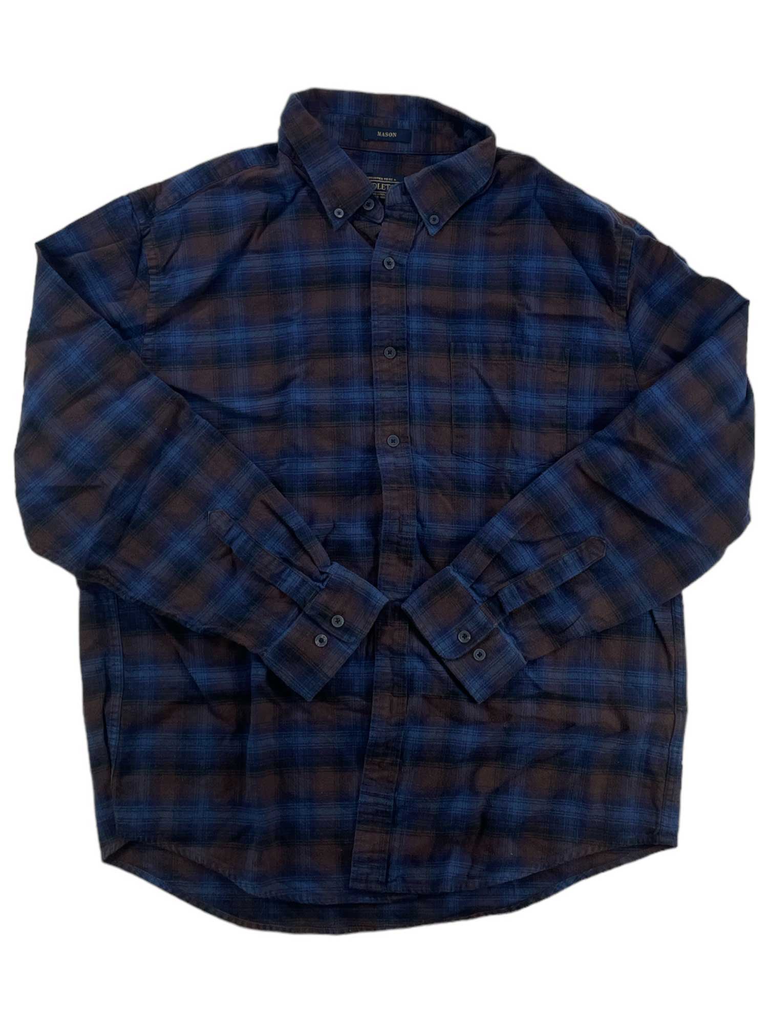 The Mason Flannel Shirt is a long-sleeve, button-up shirt in blue and dark brown plaid with a collar and buttoned cuffs, shown laid flat on a white background.
