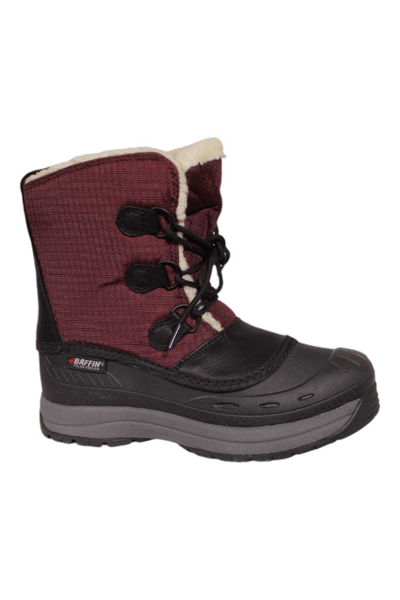 The Baffin Women's Tessa Boot features a black rubber sole and lower, maroon fabric upper, black laces, and white fleece lining. This insulated winter boot offers warmth, comfort, and rugged protection for cold weather.