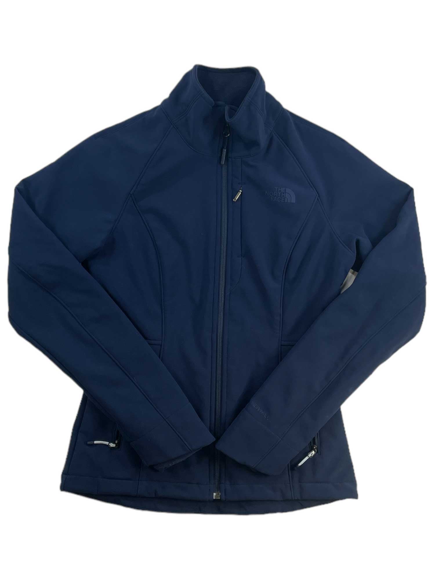 A navy blue Womens Apex Bionic Soft-Shell Jacket by The North Face with long sleeves and zippered pockets, shown laid flat on a white background.