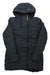 The Indyeva Womens Ayaba II Jacket is a long, black, hooded jacket with a front zipper and angled stitching, shown water-resistant and laid flat on a white background.