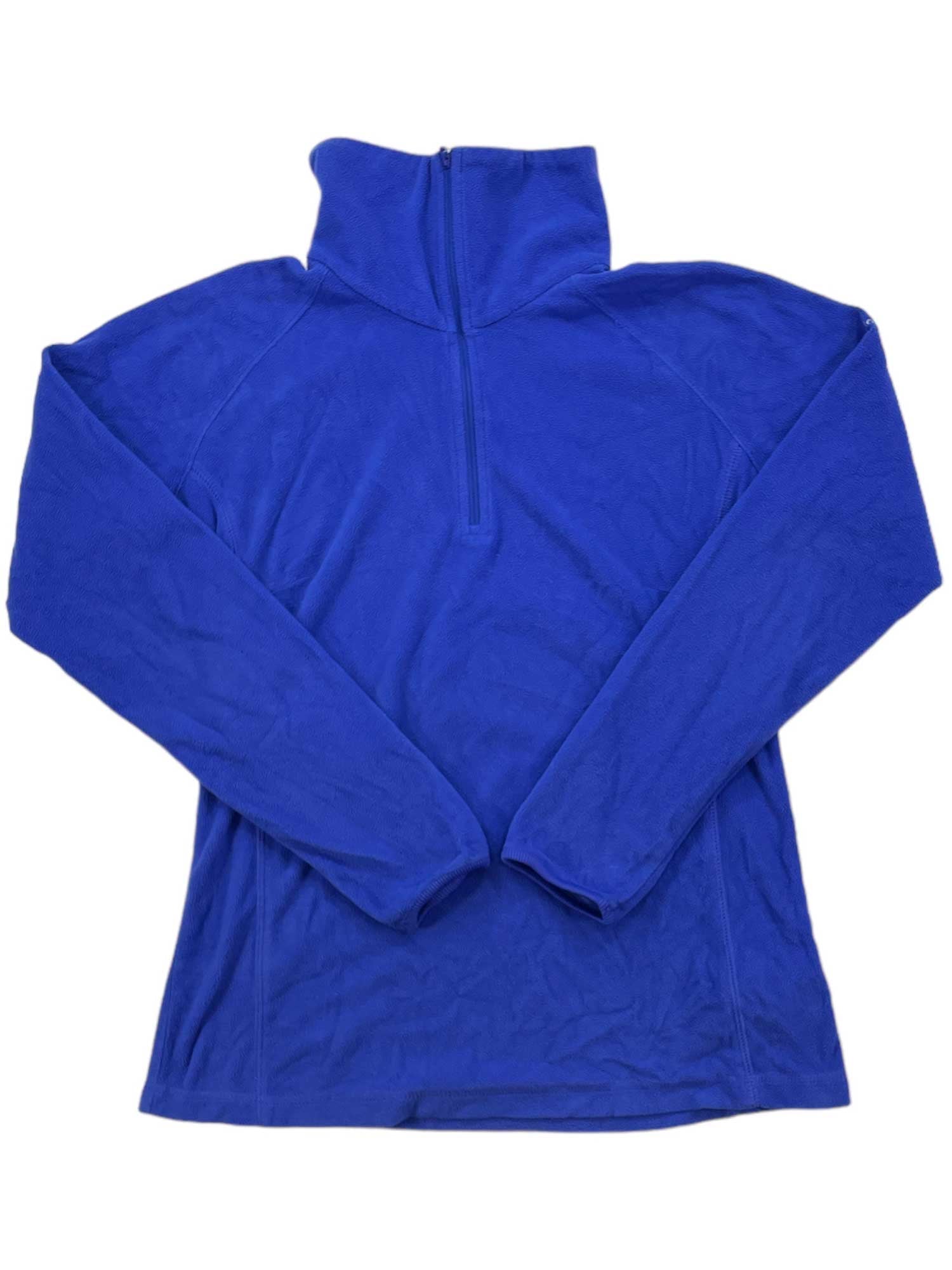 A Women's Glacial Fleece III 1/2 Zip pullover in royal blue, featuring long sleeves, a high collar, and a front half-zip closure, is laid flat on a white surface—ideal for chilly weather.